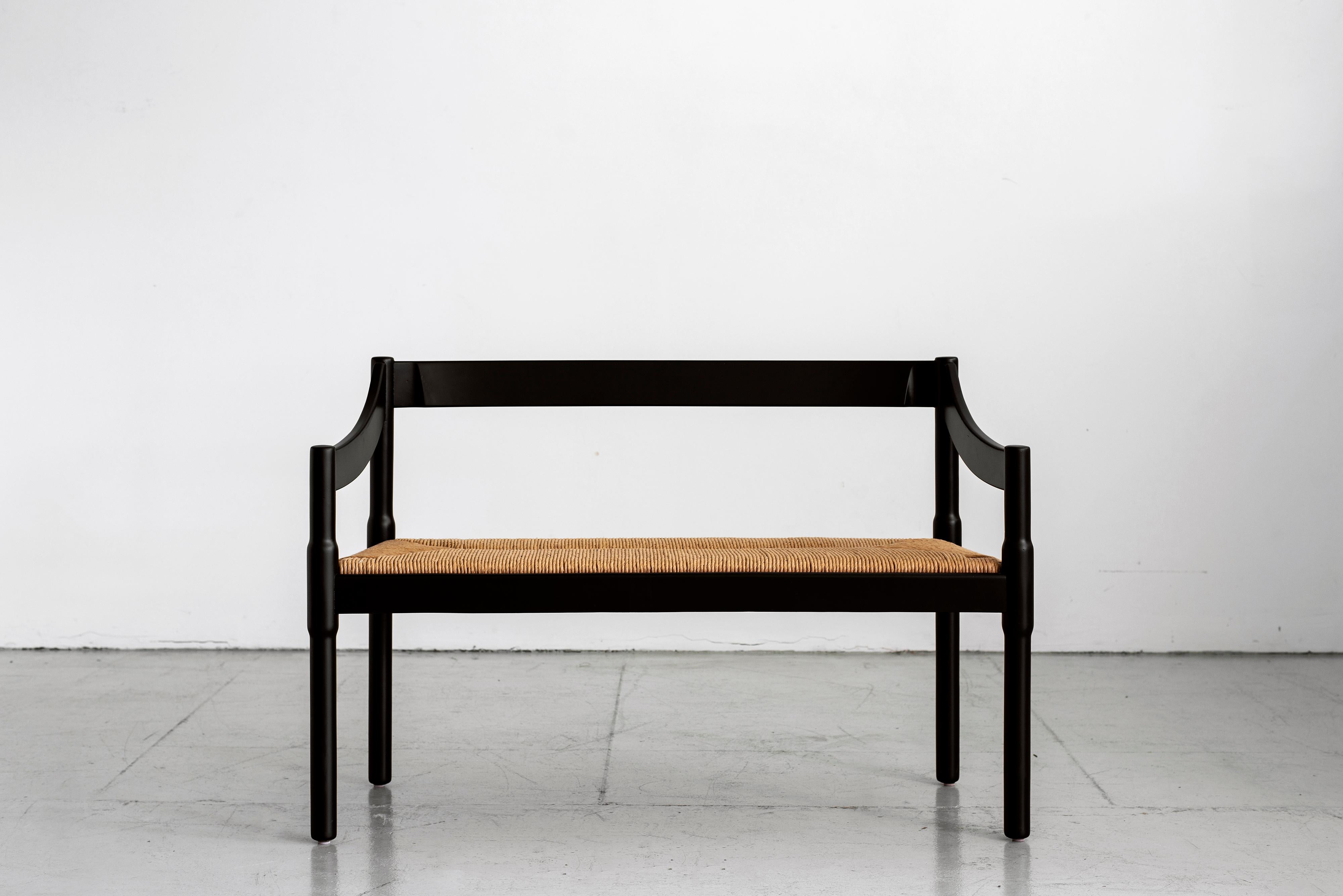 Fantastic wood and rush seat bench by Vico Magistretti for Cassina. Part of the 