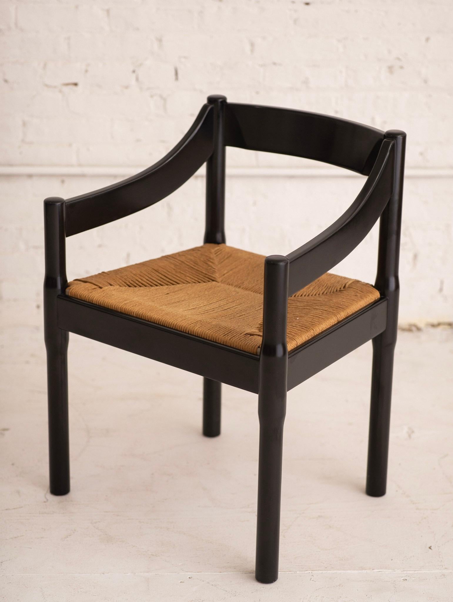 Vico Magistretti “Carimate” chair imported by Stendig. Ebonized wood finish with woven rush seating. Retains original Stendig sticker.