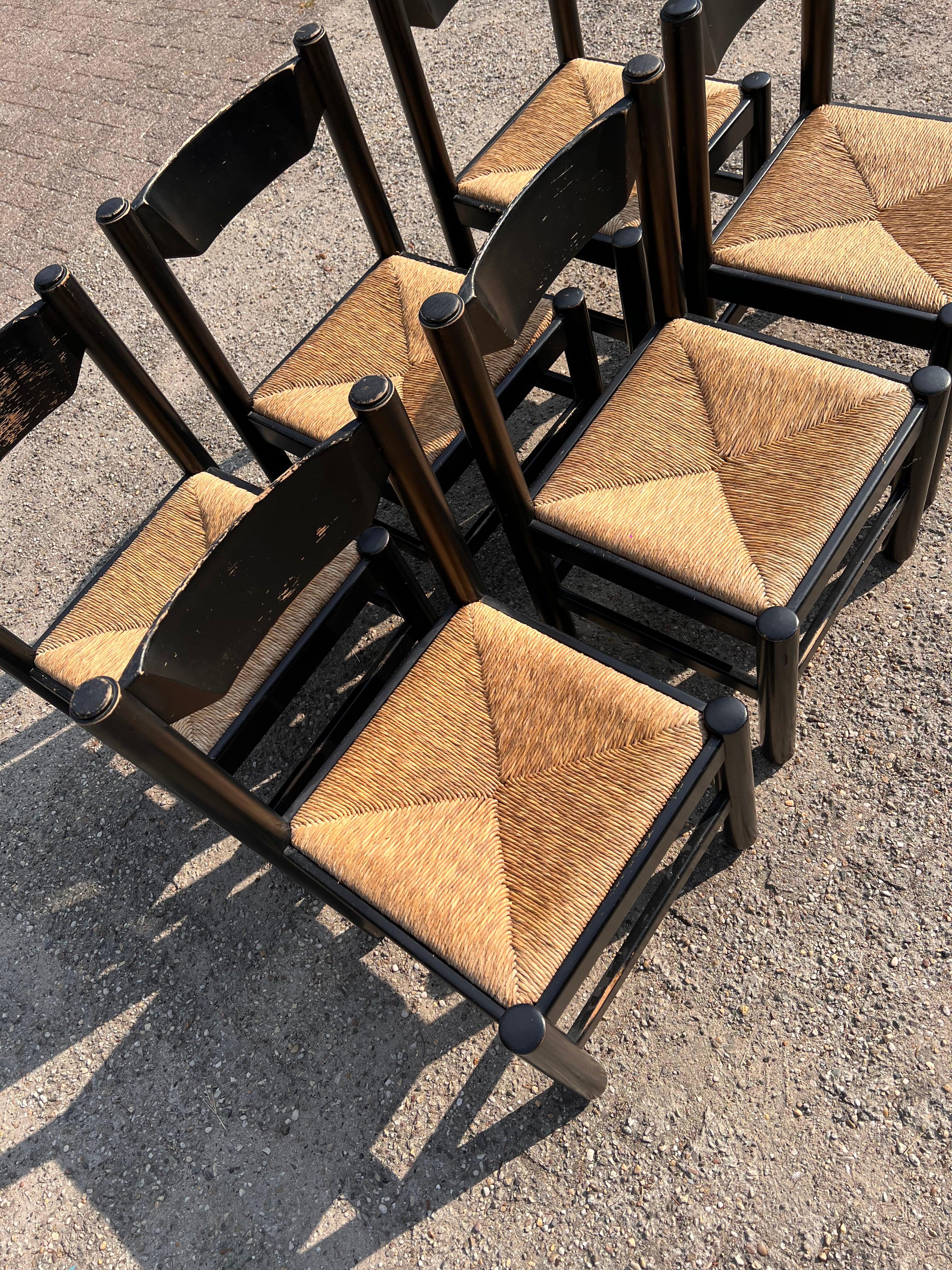 Set of 6 original Vico Magistretti dining chairs with lovely patina. The rush is in very good condition and there’s a matching table available if interested.