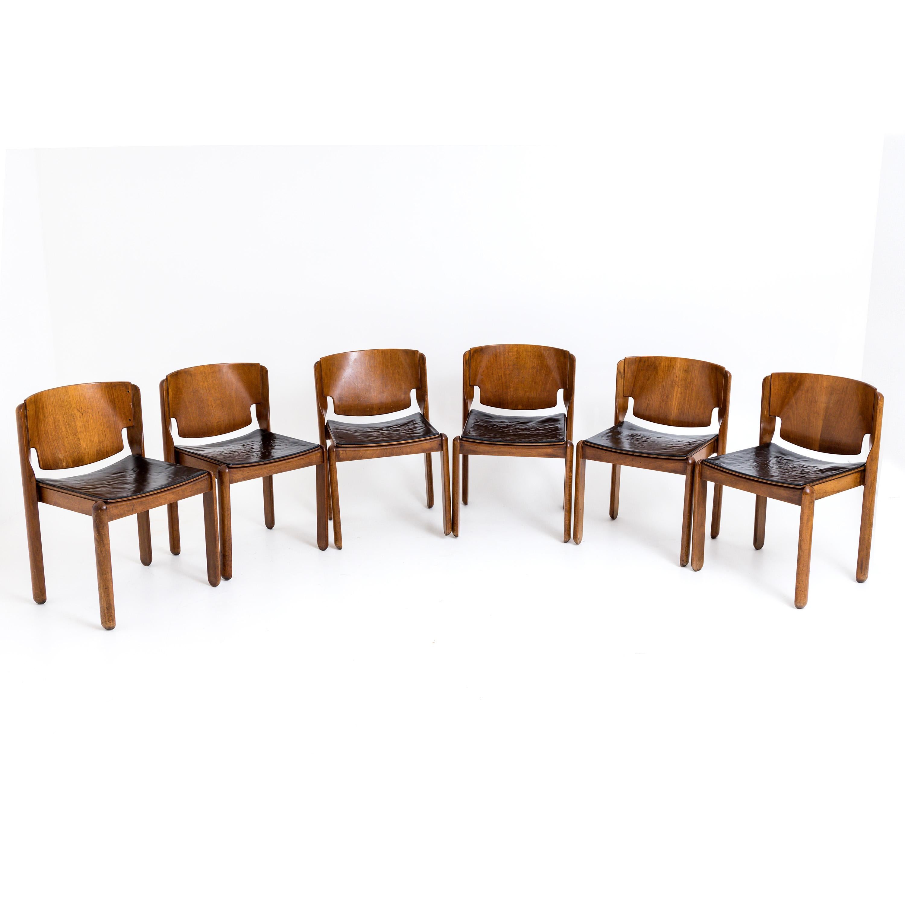 Set of six Vico Magistretti chairs, model 122 designed for Cassina in the 1960s. The seats are covered with brown leather.