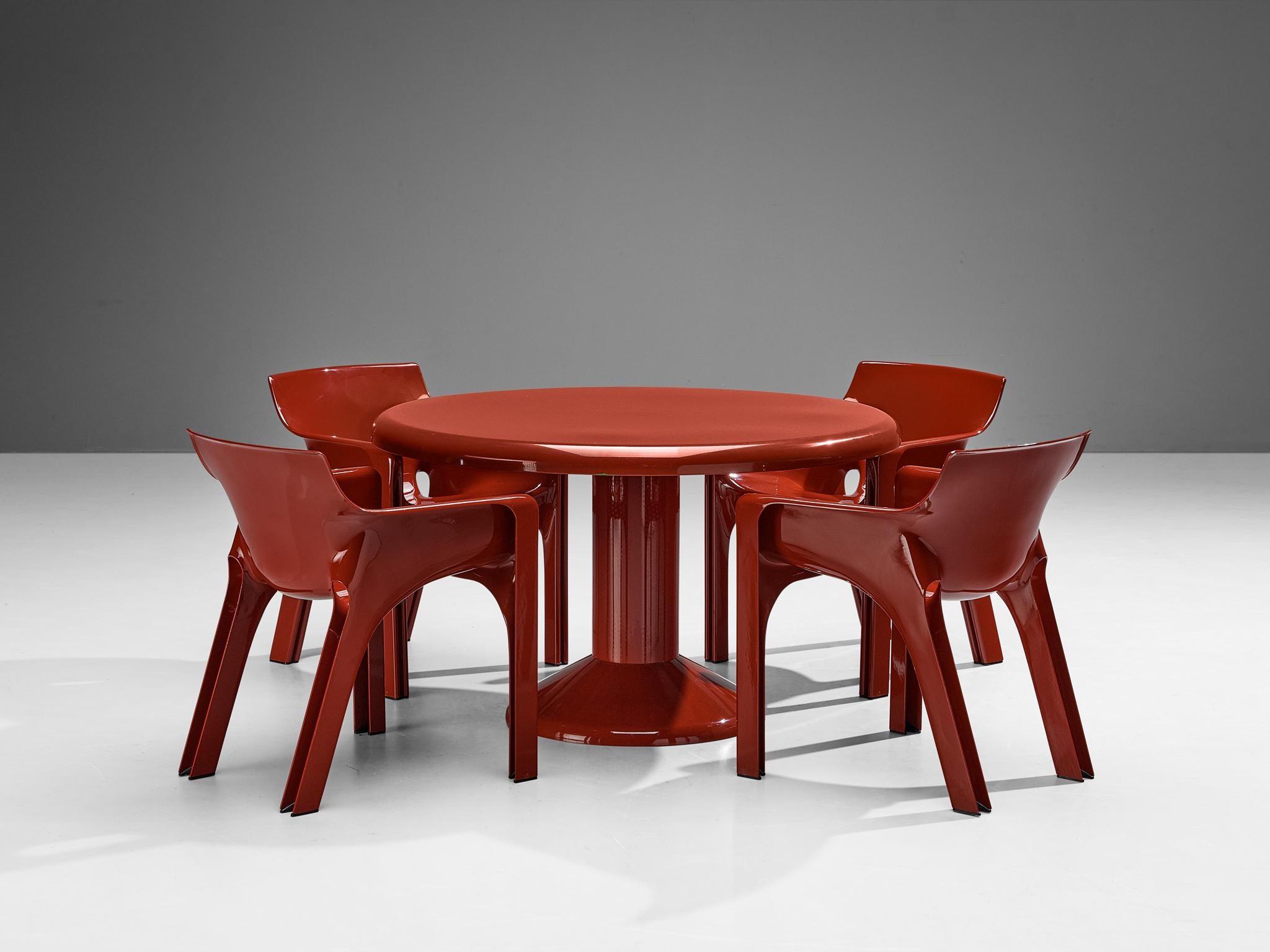 A lovely dining set consisting furniture designed by Vico Magistretti .

Vico Magistretti for Artemide, four 'Gaudi' chairs, fiberglass, Italy, 1971

These sculptural, simplistic chairs feature large, straight legs that are tilted. The seat and