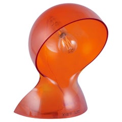 Vico Magistretti for Artemide. 'Dalu' table lamp in translucent orange plastic.