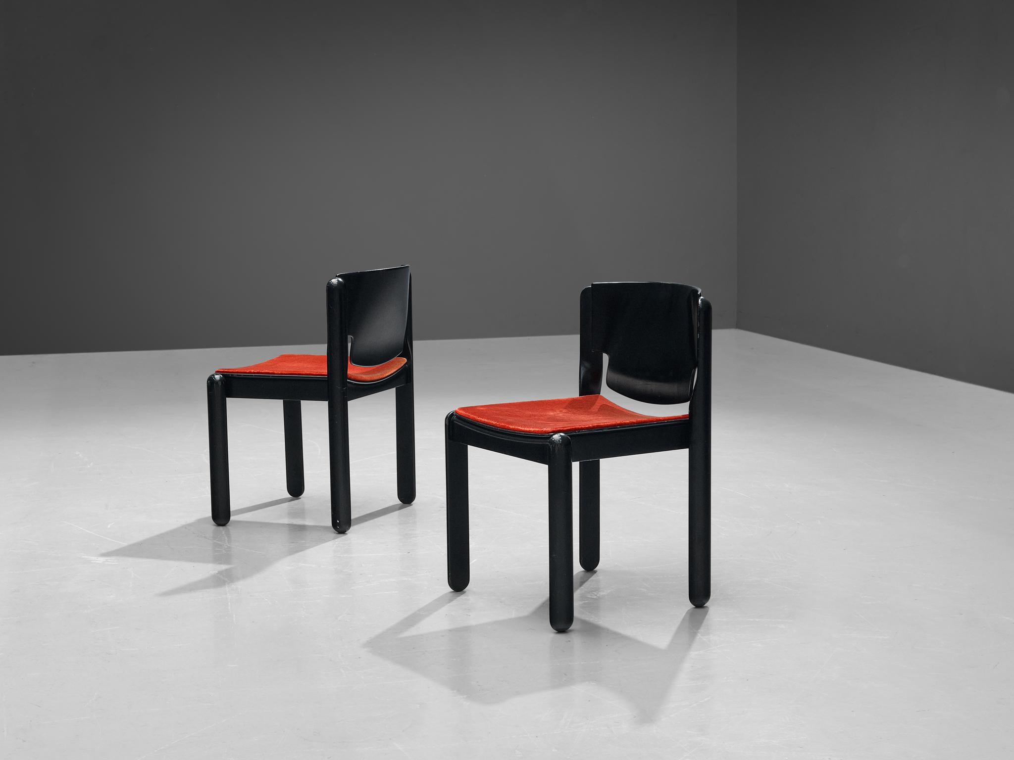 Vico Magistretti for Cassina, set of twelve chairs model '122', curved plywood, red velvet, Italy, 1967

This Italian chairs feature a remarkable sculpted back that is beautifully curved on both sides, resulting in an expansion at the bottom. The