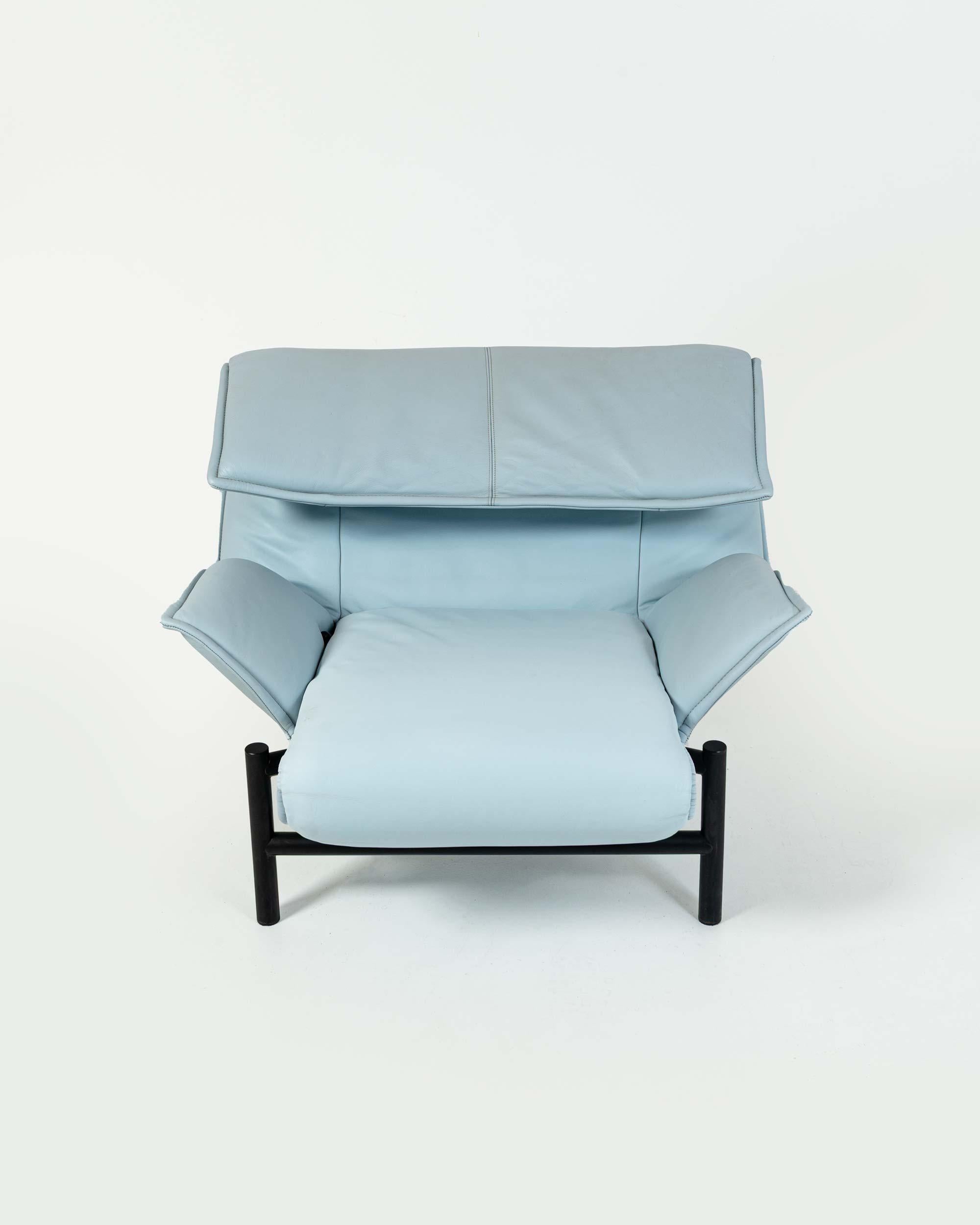 This is an unusual baby blue leather and black leg Veranda Lounge Chair designed by renowned Italian architect Vico Magistretti for Cassina. It is in overall good condition, with light wear on the leg frame and footrest. The leather is also in good