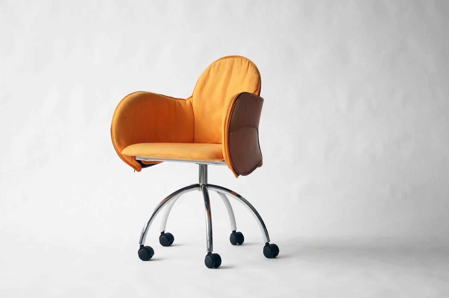 Designed in 1992  by Vico Magistretti for De Padova, Italy.  The Incisa swivel chair is the ideal seat for the corporate office and meeting room, but also for the desk of home. The chair is distinguished by its external seat leather upholstery,