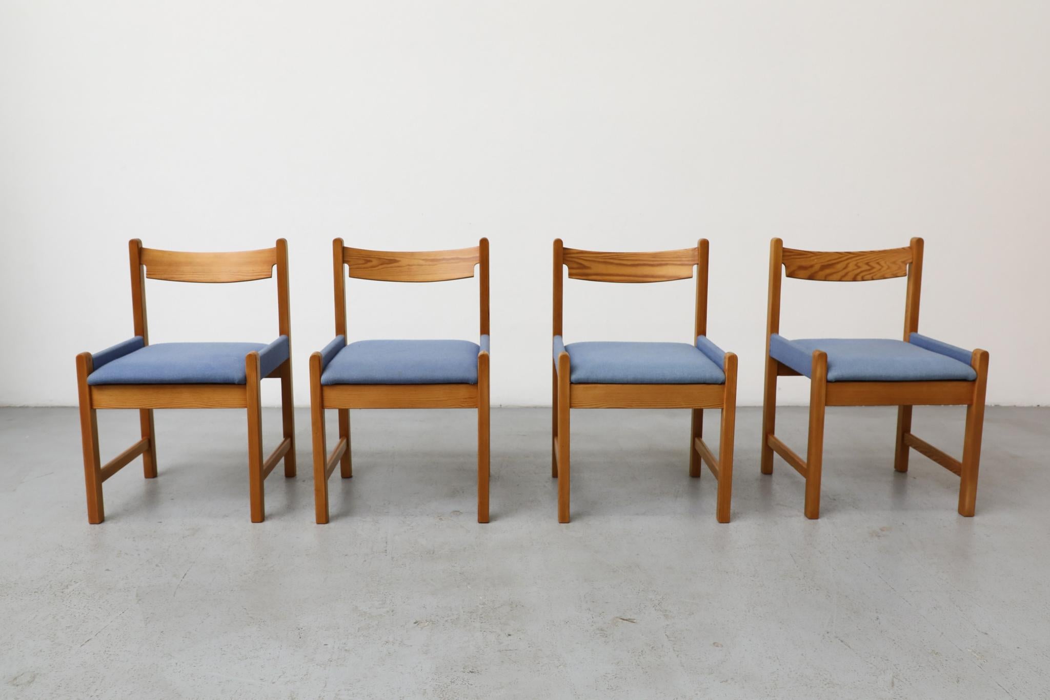 Vico Magistretti inspired set of four pine chairs with original blue upholstered seats. Seat upholstery has lovely side-wrapping detail. Frame ends have arched tops and curved, cleverly notched and angled backrest. The frames have been lightly