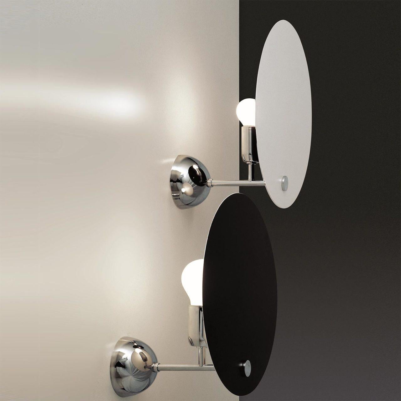 Vico Magistretti 'Kuta' wall lamp for Nemo in black.

A wall lamp originally designed in the 1970's by renowned Italian designed Vico Magistretti, the Kuta features a circular reflector executed in aluminum.  This clever design, featuring a circular