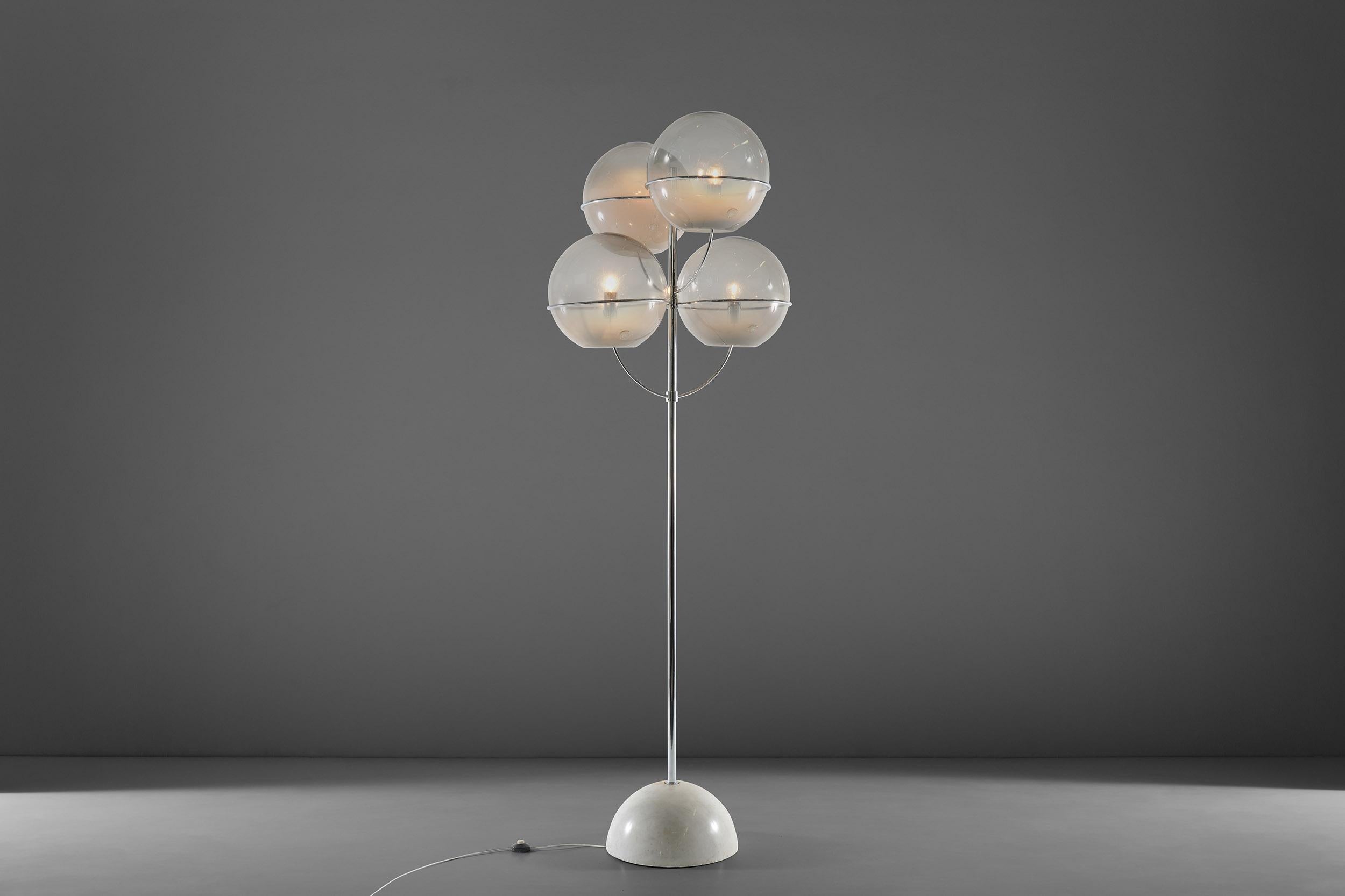 This rare Lyndon floor lamp was designed by Vico Magistretti in 1968 for Knoll International. With a Zinc-plated metal structure and marble base, this floor lamp features 4 glasses, each shade with applied glass seal inscribed 