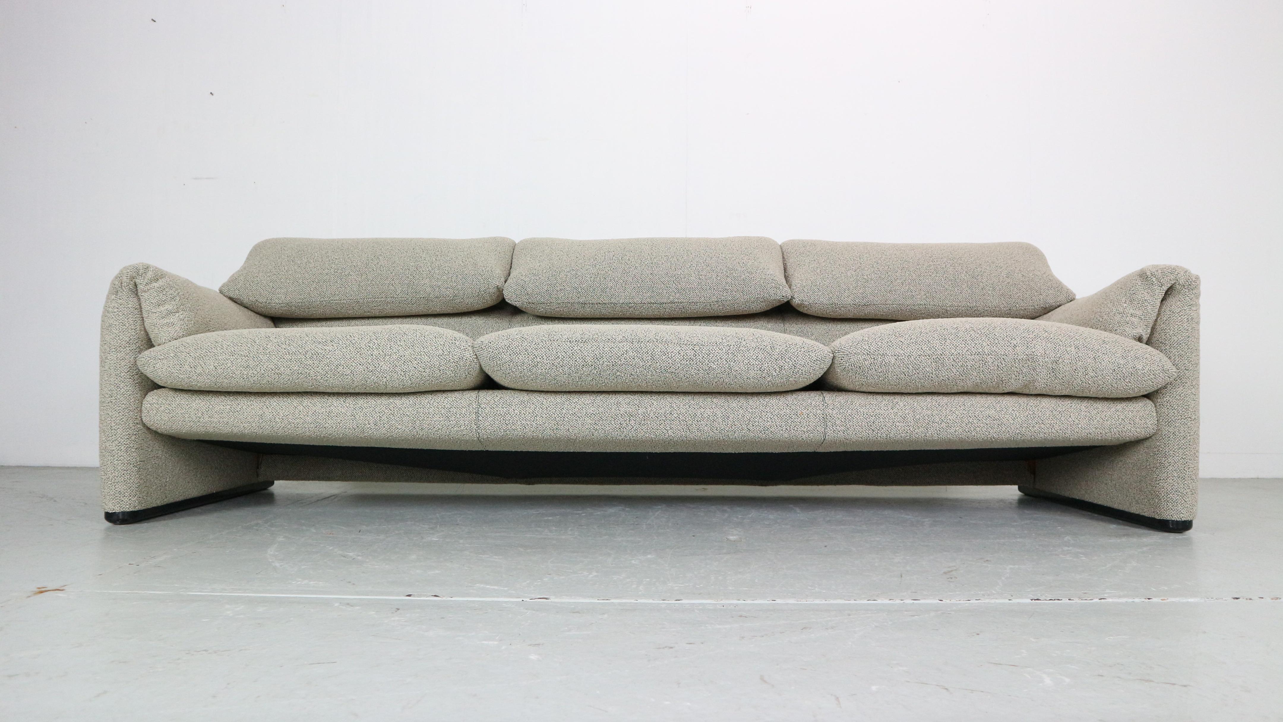 If it's classic Italian style you're after, look no further!

Maralunga 3-seat Sofa, designed 1973 by Vico Magistretti for Cassina. This sofa features folding back rests cushions that can be folded down, or folded up to provide the user with more