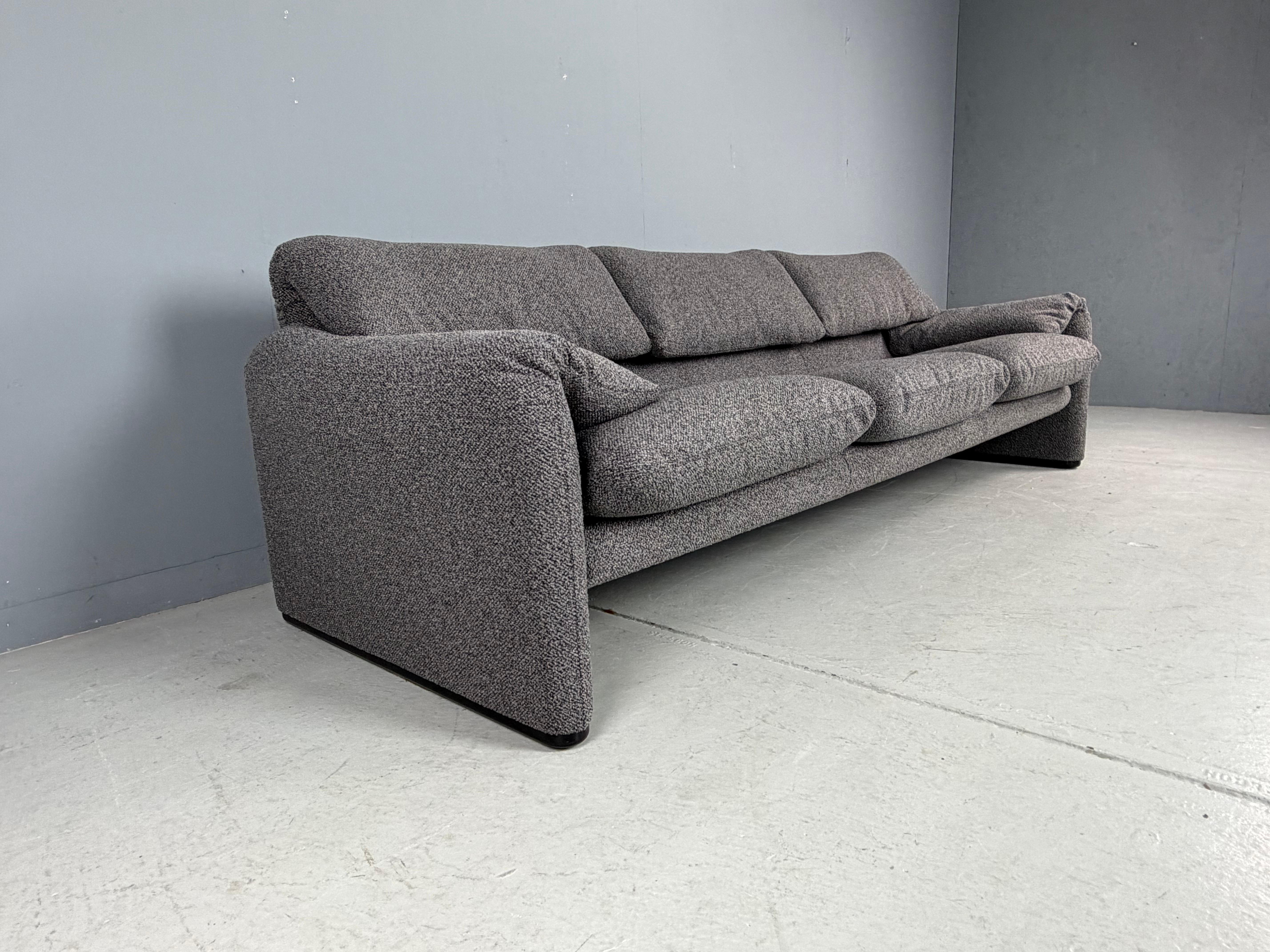 If it's classic Italian style you're after, look no further!

Maralunga 3-seat Sofa, designed 1973 by Vico Magistretti for Cassina. This sofa features folding back rests cushions that can be folded down, or folded up to provide the user with more