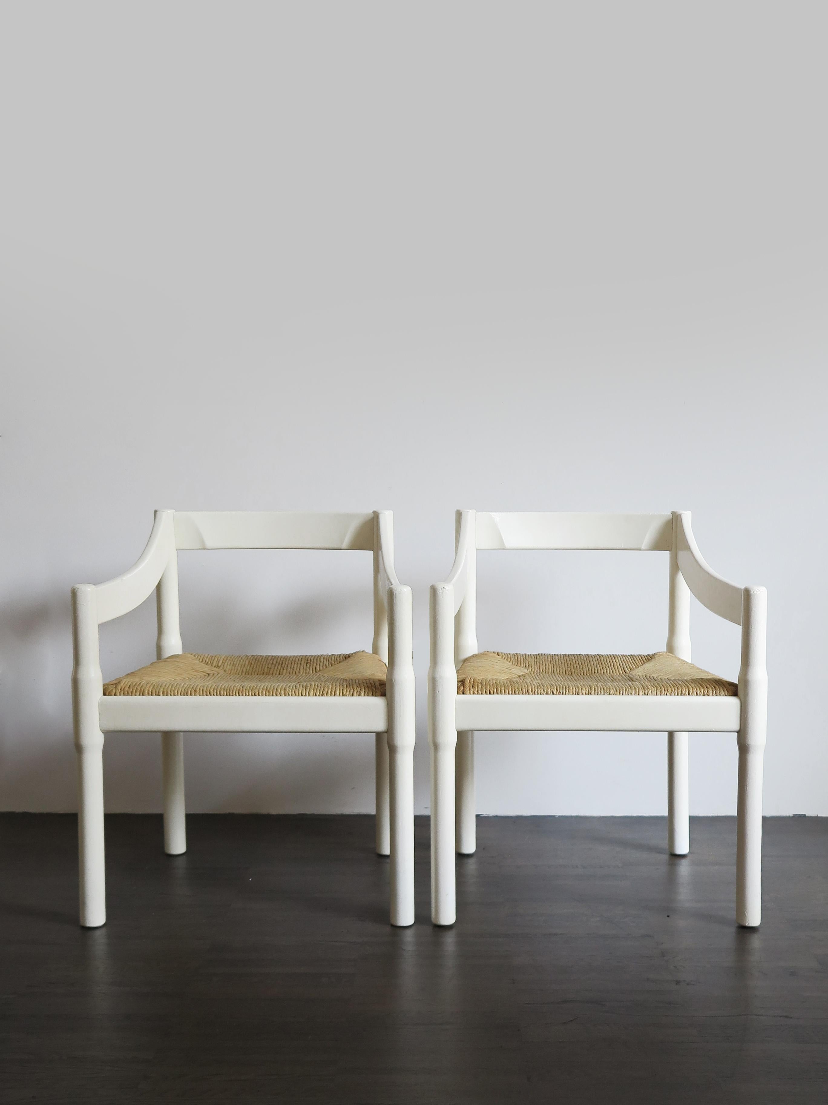 Set of two Italian mid-century armchairs model Carimate designed by Vico Magistretti for Country Club Carimate in Italy with aniline-stained beechwood frameand straw seat, produced by Comi then Artemide and finally Cassina, Italy 1960s

Literature