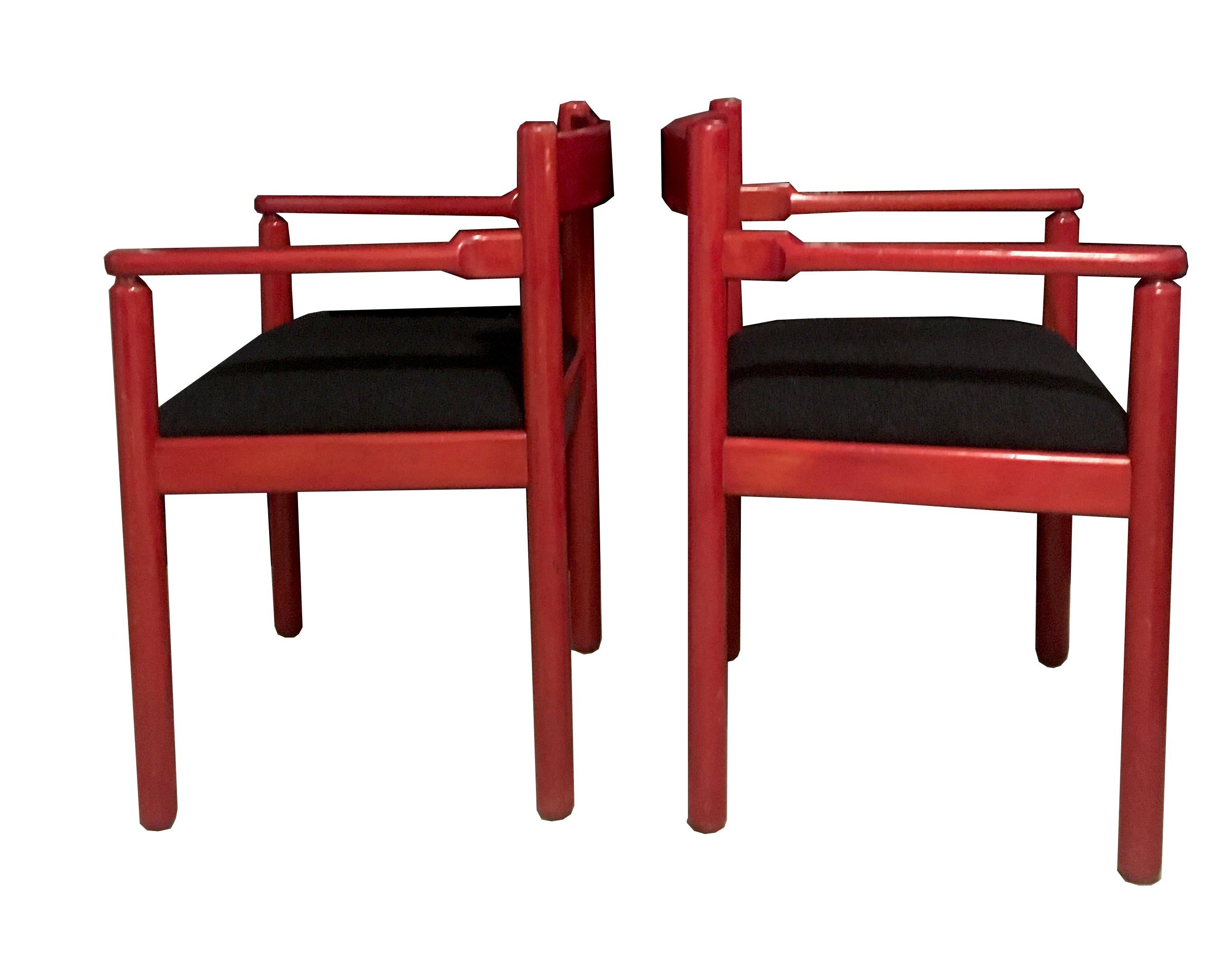 Pair of dining room chairs designed by Vico Magistretti for Cassina manufacture in 1964, Italy.
Black fabric seating and red lacquered wooden frame.