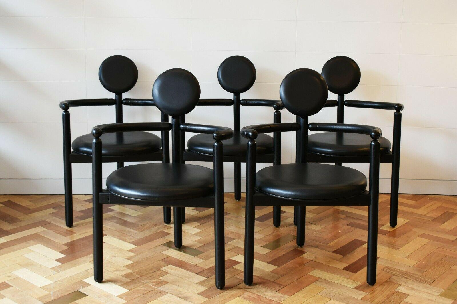 An extremely rare and super stylish dining set designed by Italian designer Vico Magistretti for Rosenthal Einrichtung, 1980's.

This set comprises of a dining table and 6 chairs, in black ash wood with black leather seat and back rests on the