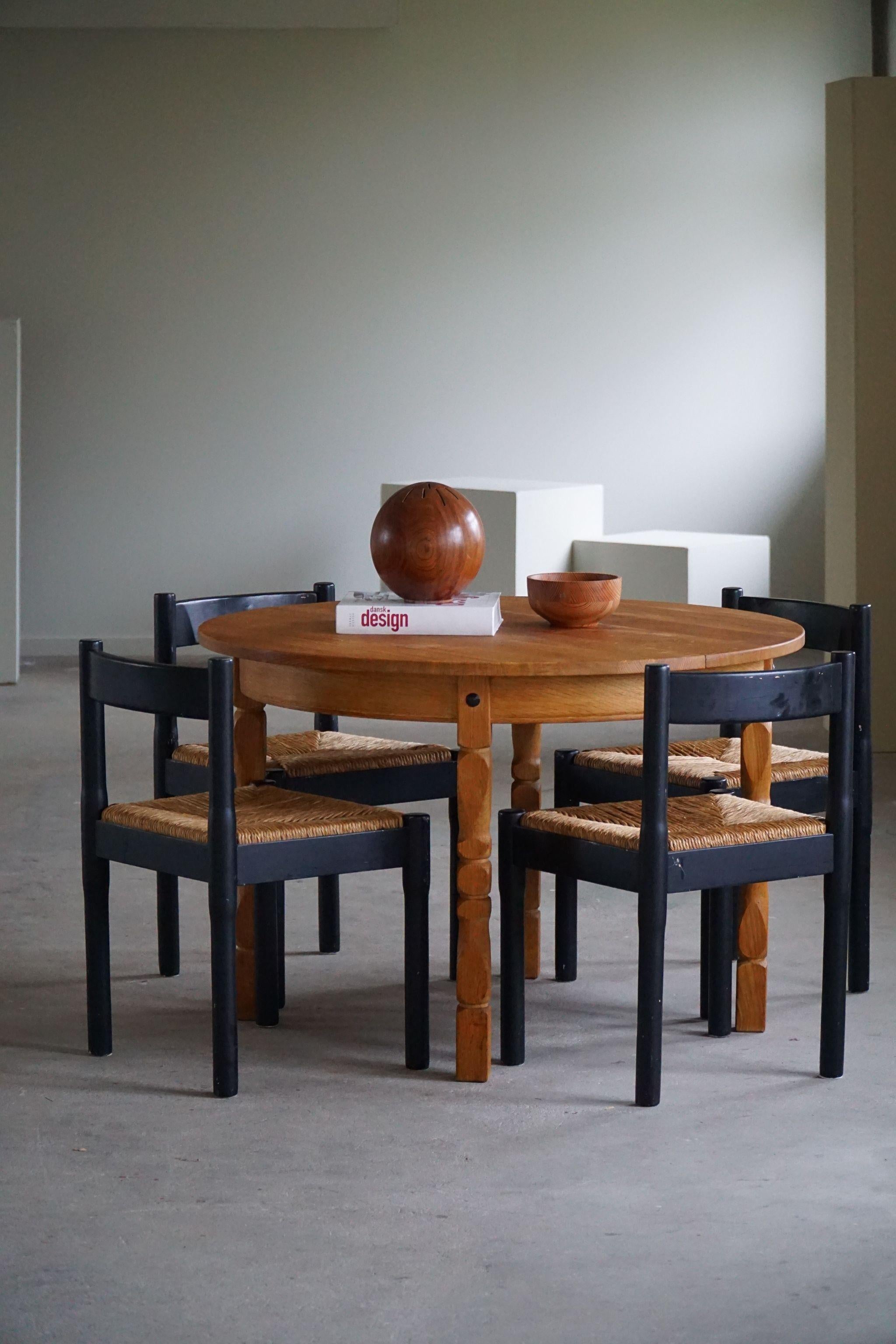 Set of 4 iconic Carimate dining chairs in solid wood and straw. Later painted black. 
Designed by Italian designer Vico Magistretti, made at Cassina in 1970s. 
This model was designed for 