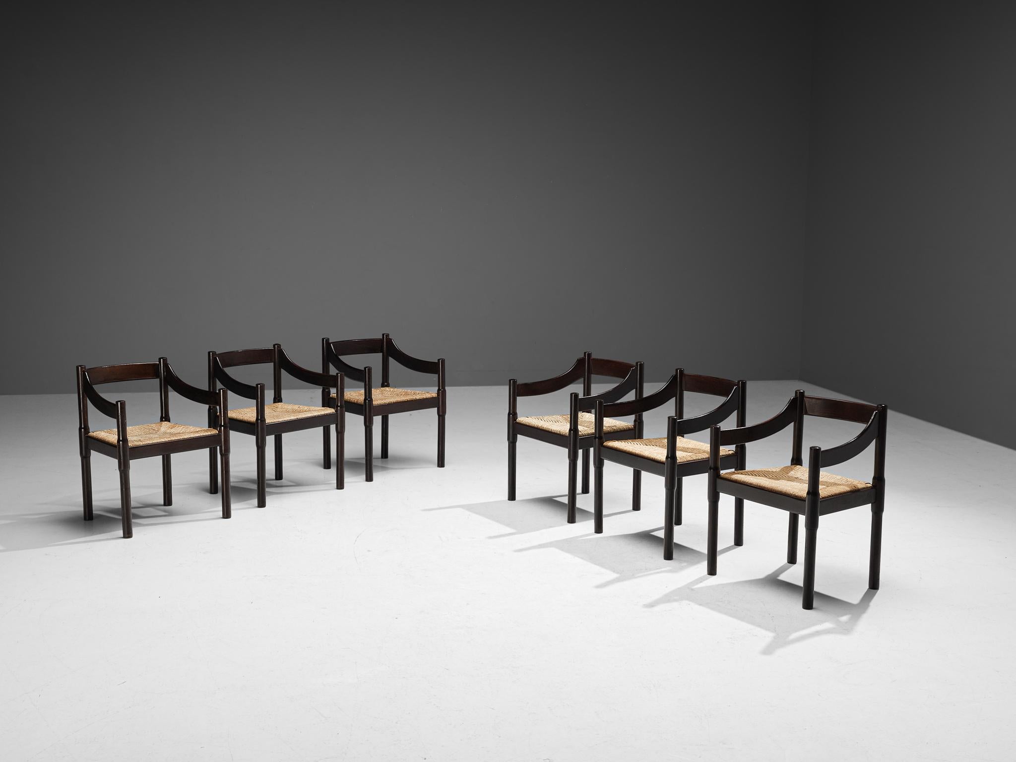 Vico Magistretti, set of six dining chairs model ‘Carimate’, stained beech, rush, Italy, designed circa 1960

The ‘Carimate’ chair is one of Vico Magistretti’s most famous chairs. Originally designed in a red color for the ‘Carimate Golf Club’ in