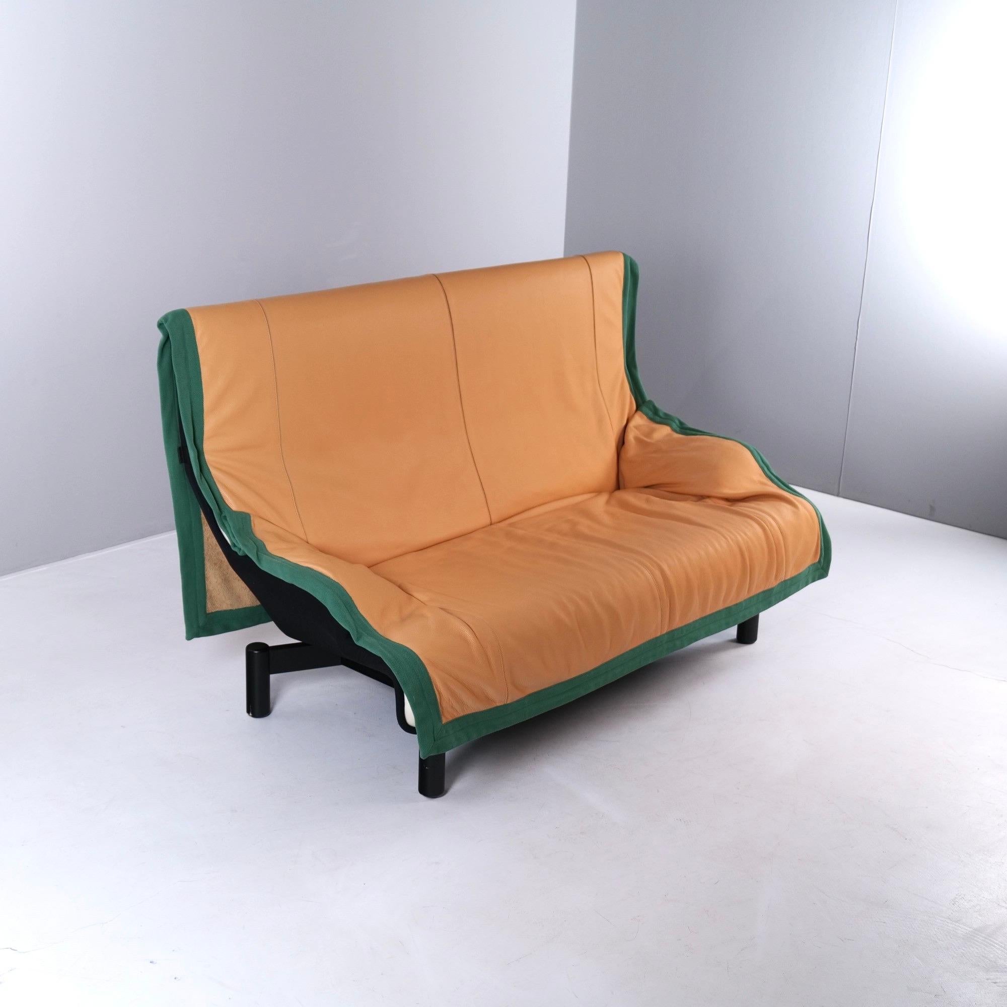 The sofa mod. Sinbad by Vico Magistretti has a throw blanket in leather that extends far over the backrest .
Base in black lacquered wood.
In all the sofa is in excellent condition.
This was one of the sofas that Vico Magistretti appreciated the