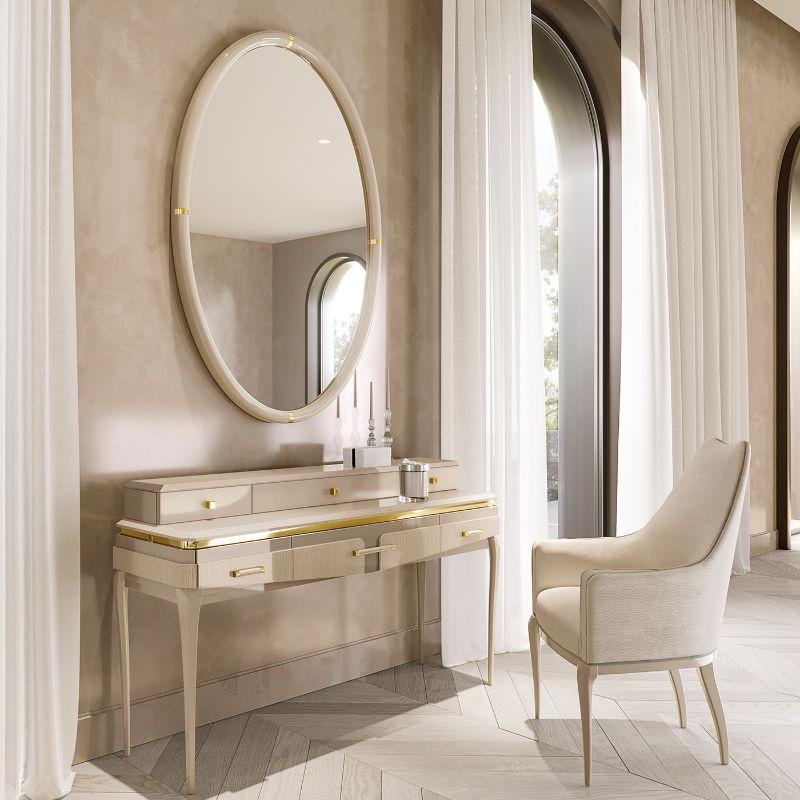 A stupendous design of utmost refinement, this vanity table will make an elegant statement in a modern bedroom, especially if combined with other items from the Victor Collection. Handcrafted of ivory sand-finished ash and enriched with metal