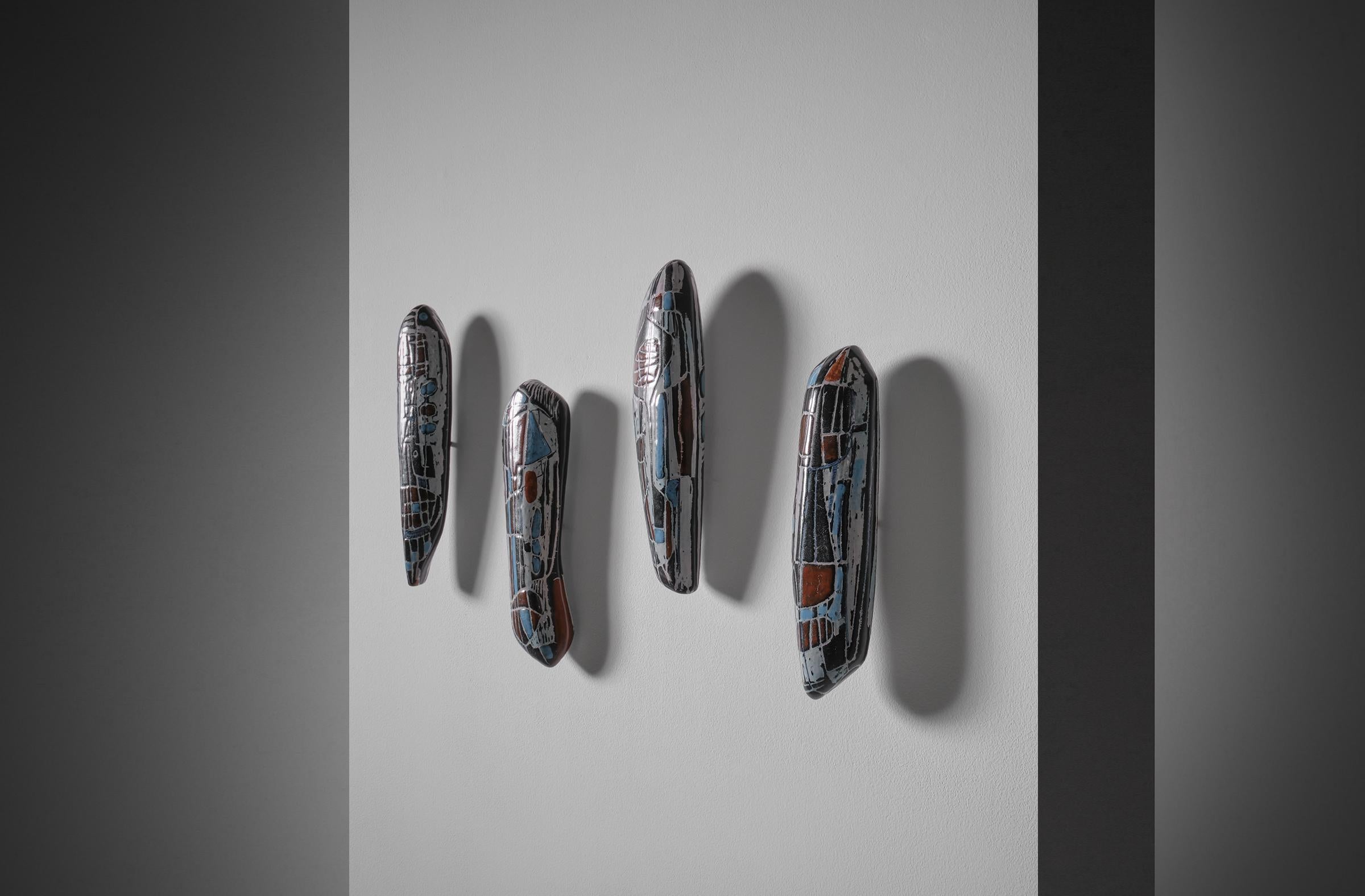 Set of four ceramic coat hangers by Victor (Vittorio) Cerrato (1917 - 2008), Italy 1960s. Cerrato was both sculptor and ceramist, he opened his ceramic workshop in Turin in the early years after the Second World War. His work is very artistic and