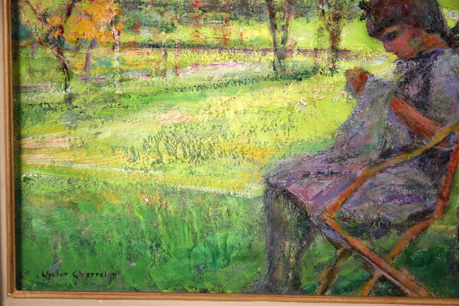 Signed figure in landscape oil on board circa 1920 by sought after French post impressionist painter Victor Charreton, who was known as the painter of colours. The piece depicts a young girl wearing a dress and a bow in her hair sewing as she sits