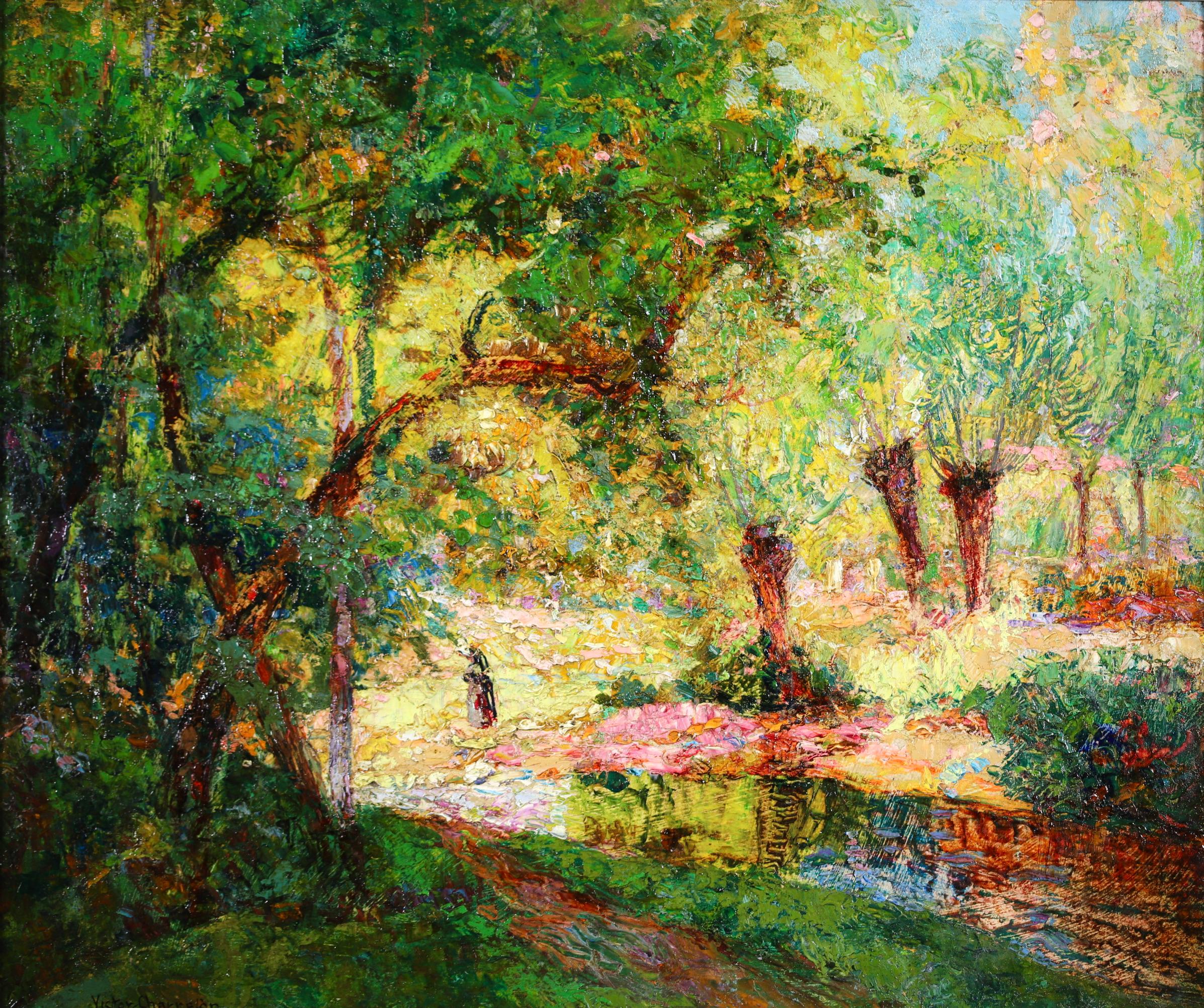 Signed figure in landscape oil on board circa 1910 by French Post-Impressionist painter Victor Charreton. The piece depicts a lone figure taking a walk beside a stream in a wooded area on a bright summer's day. The work is beautifully