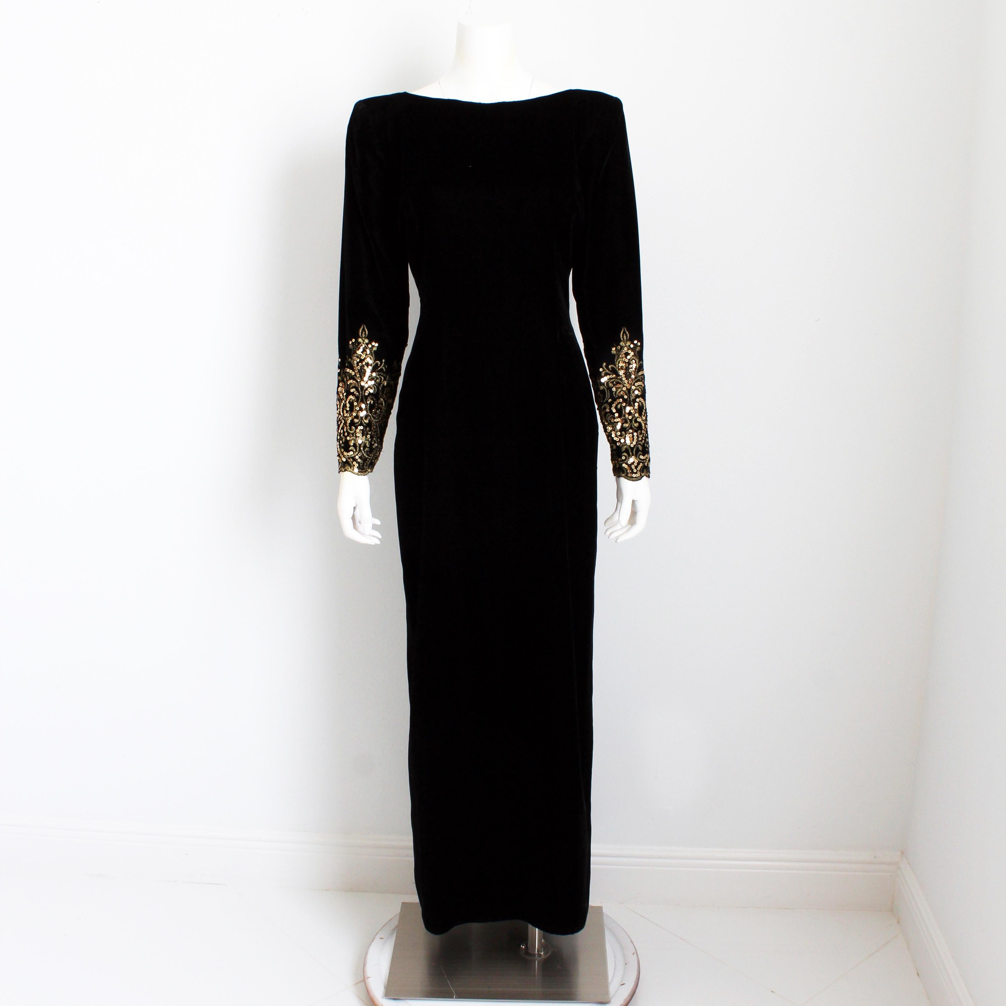 Authentic, preowned, vintage Victor Costa evening gown, likely made in the 90s. Made from black velvet, it features gorgeous embellished sleeves and a plunging back - sexy and chic! Fastens with zipper in back and has a slight train to the back hem.