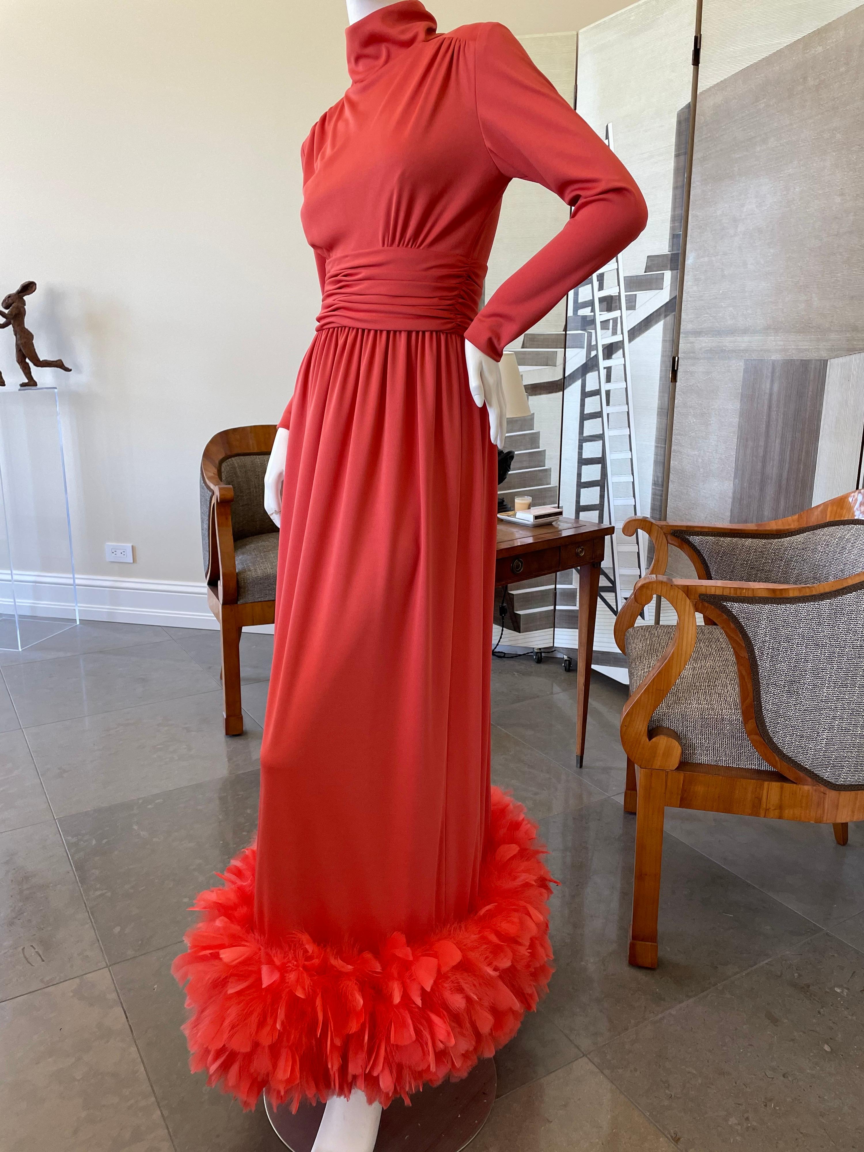 Victor Costa for I. Magnin 1970's Coral Evening Dress with Wide Feather Hem.
This is such a wonderful piece, in the iconic color of the 70's.
Please use zoom feature to see the details.
No Size tag, I estimate it is size 6
Bust 36