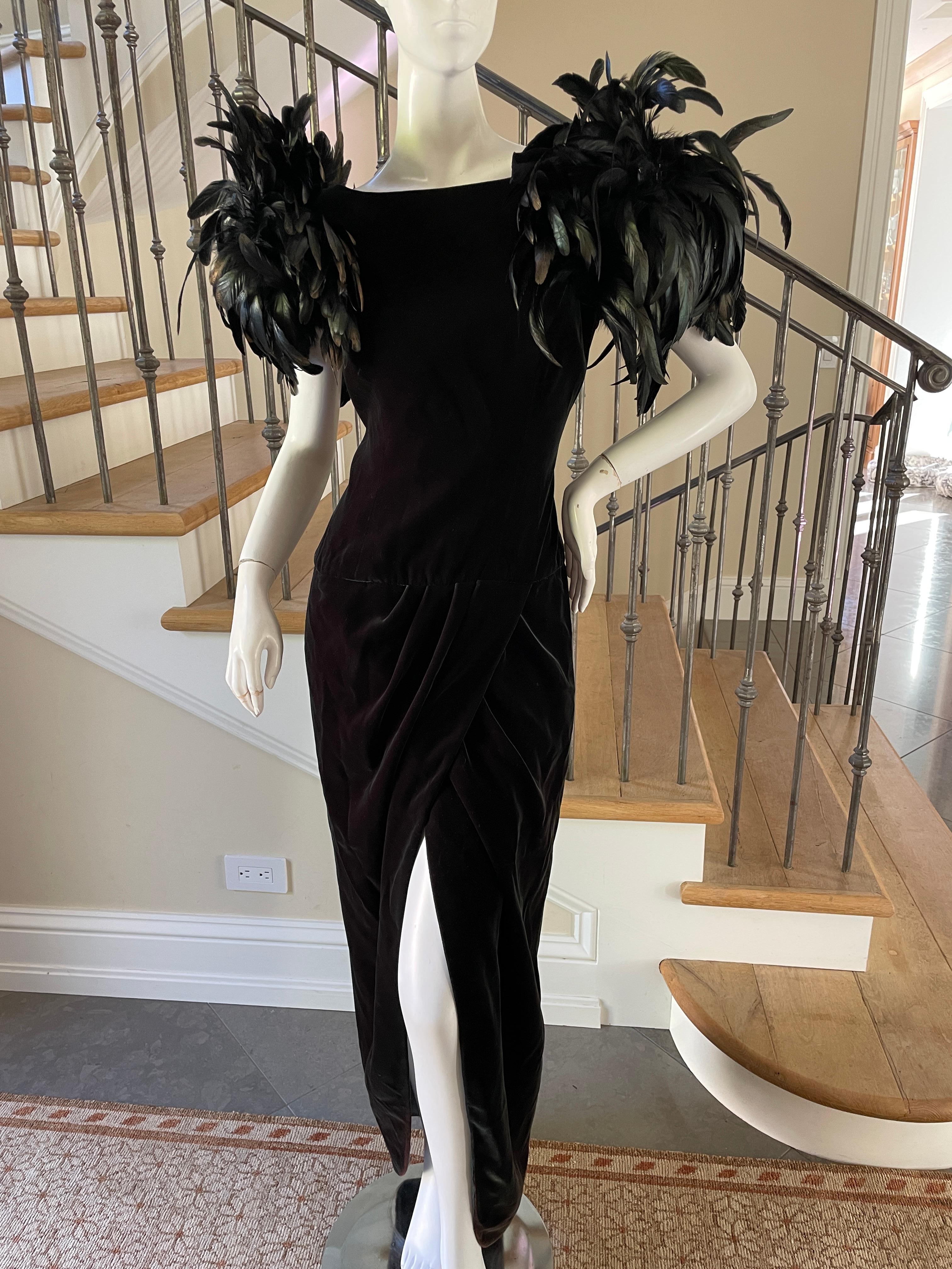 Victor Costa for I Magnin Stunning 1980's Green Velvet Evening Dress with Exaggerated Coq Feather Shoulders.
This is sensational, a real entrance maker, with a high slit, and low cut back.
No size tag, I would estimate it size 6
Bust 39