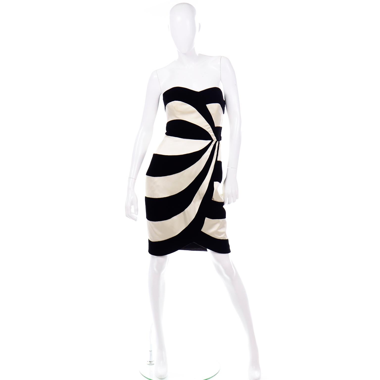 This such a fun and flattering Victor Costa vintage cocktail dress from the 1980's! The strapless evening dress has a sweetheart neckline and alternating thick stripes of black velvet and ivory satin. The waist is nicely fitted and all the stripes