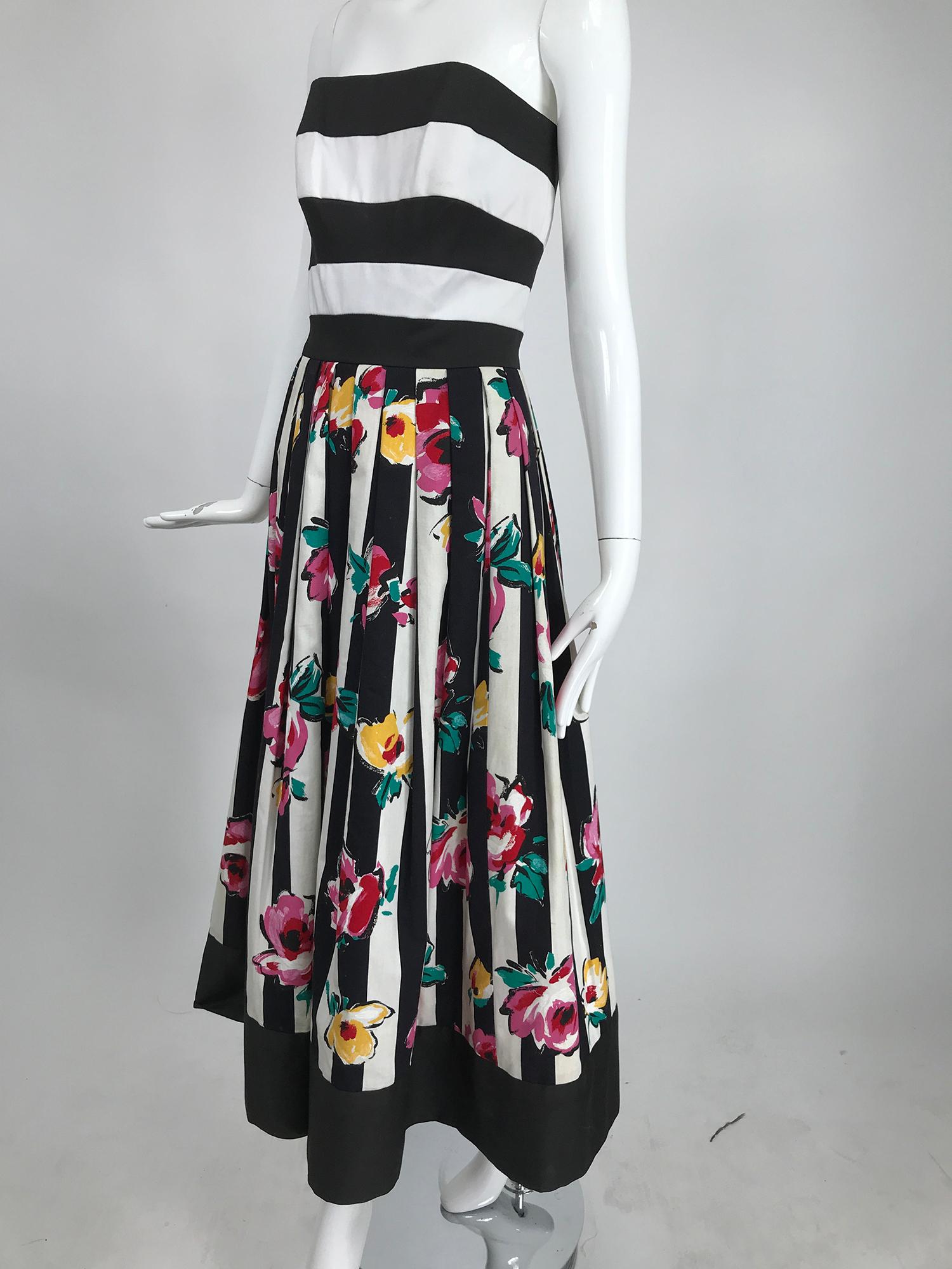 Victor Costa strapless black and white stripe floral fit and flare dress from the 1990s. This beautiufl dress is so bright and cheerful, the combination of the bold black and white stripes of the bodice and the blazing flowers on the skirt is