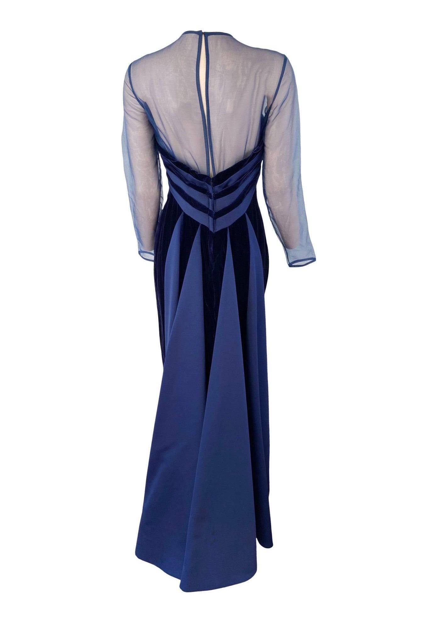 Absolutely stunning Victor Costa vintage evening gown! The dress is a super-soft, deep navy velvet with contrasting-textured navy satin accents. The satin forms inset panels at the back of the skirt, creating a small train effect, as well as