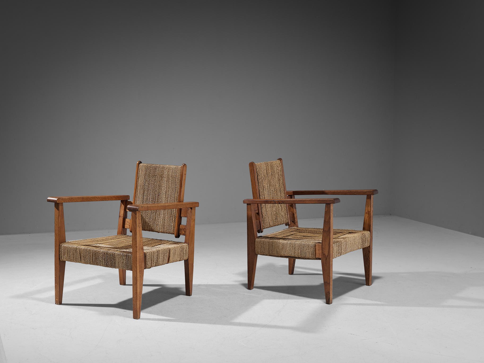 Victor Courtray, pair of armchairs, straw, oak, France, circa 1940

This rare pair of lounge chairs embraces an evolved provincial character with great quality of elegance. The type of upholstery and construction, give the chair a character of its