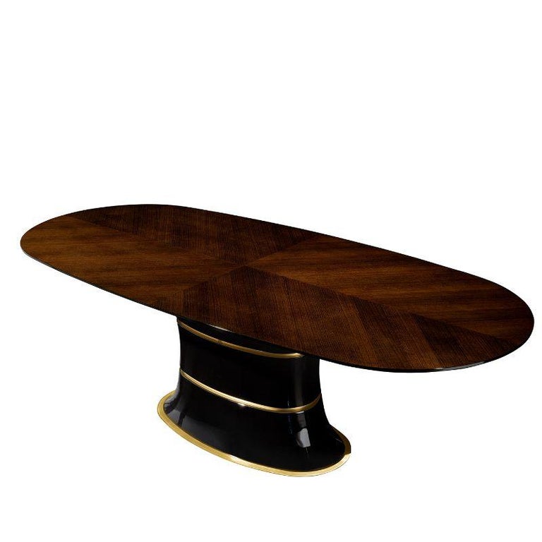 A bold and iconic statement piece for a modern and refined interior, this extraordinary dining table from the Victor Collection will not go unnoticed. Boasting an oval, elliptical shape, it features a veneered ash wood top and a likewise wooden base