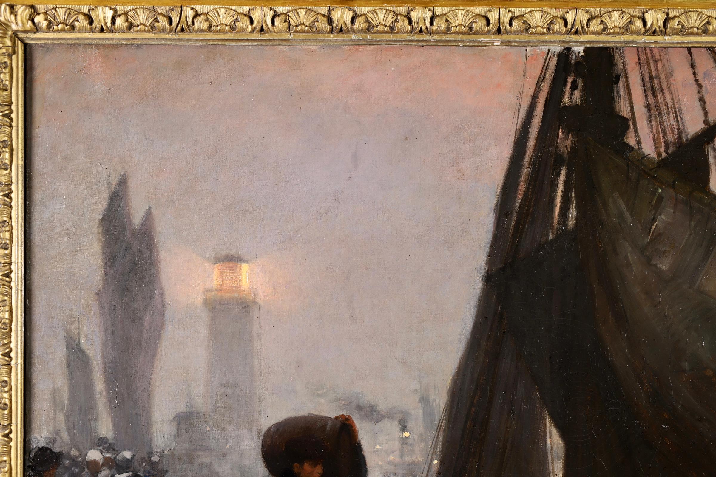 Signed realist figurative oil on original canvas by French painter Victor Gabriel Gilbert. The work depicts workers unloading boats in by the light of the lanterns on a cold, wet evening. The lighthouse can be seen illuminated in the distance.