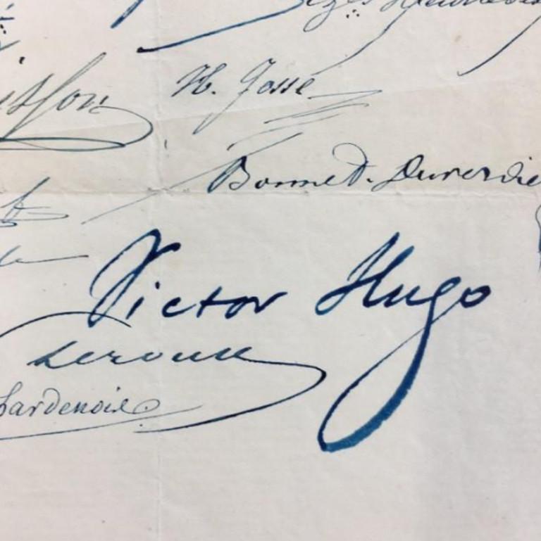 A document signed by Victor Hugo in vibrant blue ink. 

Victor Hugo is the author of some of the most celebrated works in French literature, including Les Miserables (1862) and The Hunchback of Notre-Dame (1831).

Victor Hugo signed this