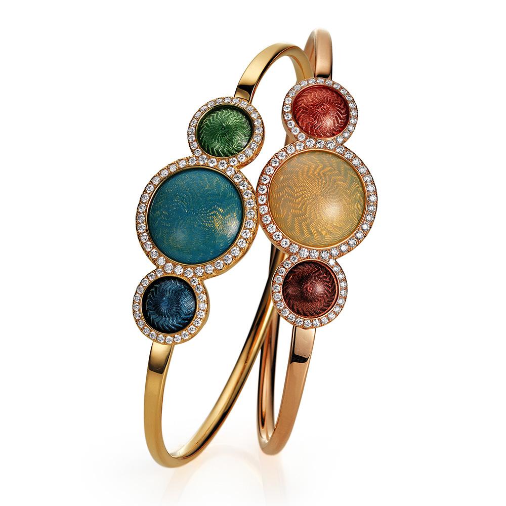 Victor Mayer Candy Bracelet 18k Yellow Gold with Diamonds and Multicolor Enamel

Bangle, 18k yellow gold, opal turquoise, medium blue and light turquoise vitreous enamel, candy guilloché, 78 diamonds together 0.73 ct
Reference: