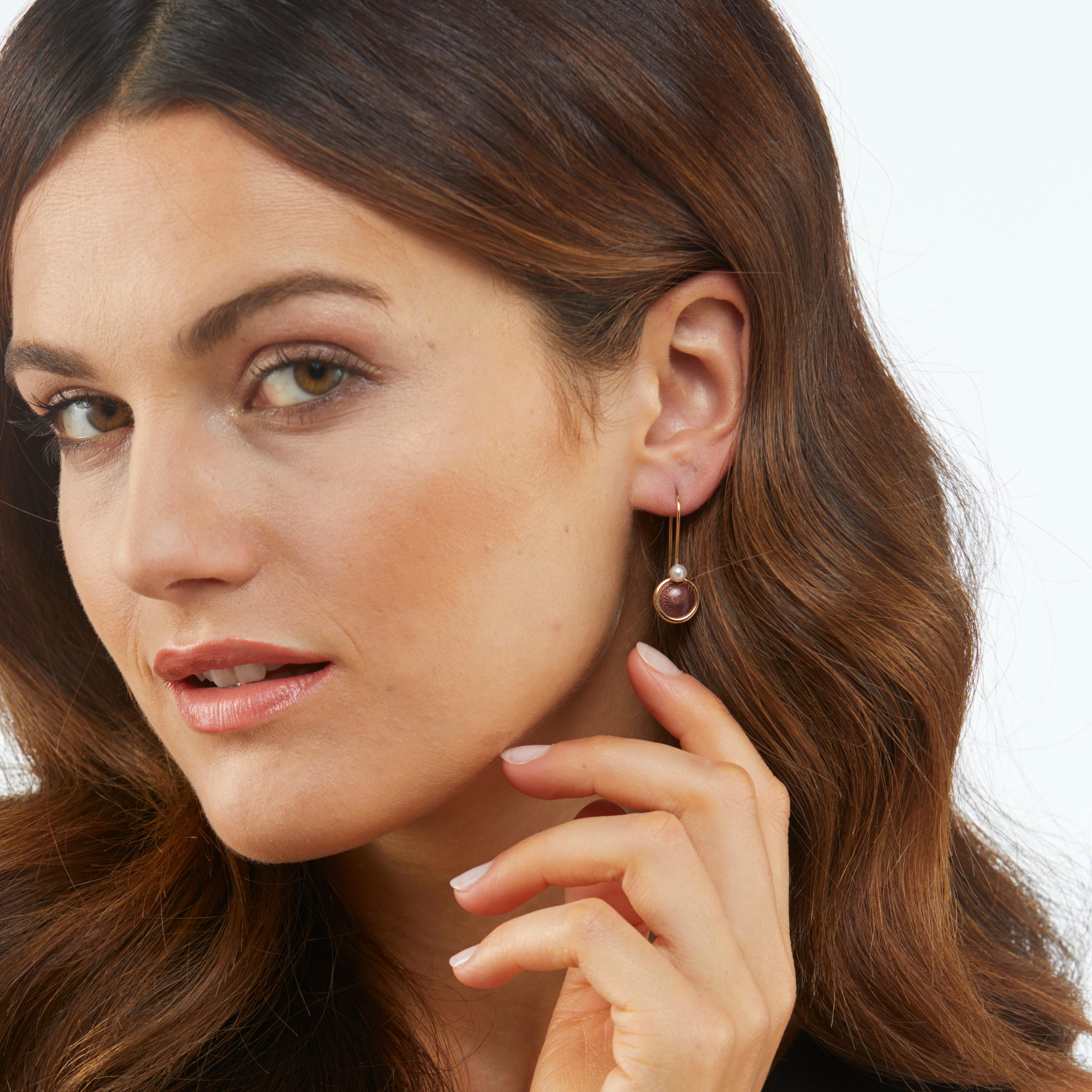 Victor Mayer round dangle earrings 18k yellow gold, Candy collection, translucent wine red vitreous enamel, guilloche, 2 akoya pearls, diameter with eyelet app. 11.6 mm x 24.8 mm

About the creator Victor Mayer 
Victor Mayer is internationally