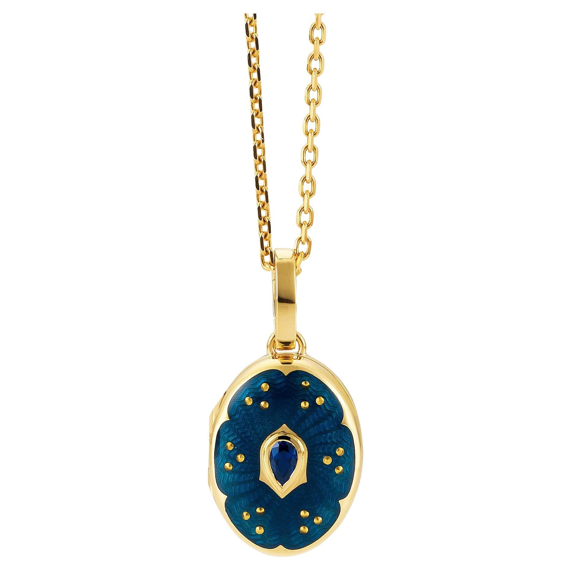 Oval locket pendant, 18k yellow gold, Victoria Collection by Victor Mayer, petrol blue vitreous enamel with paillon inlays, 1 facetted pear shaped sapphire, measurements app. 20.0 mm x 15.0 mm

About the creator Victor Mayer
Victor Mayer is