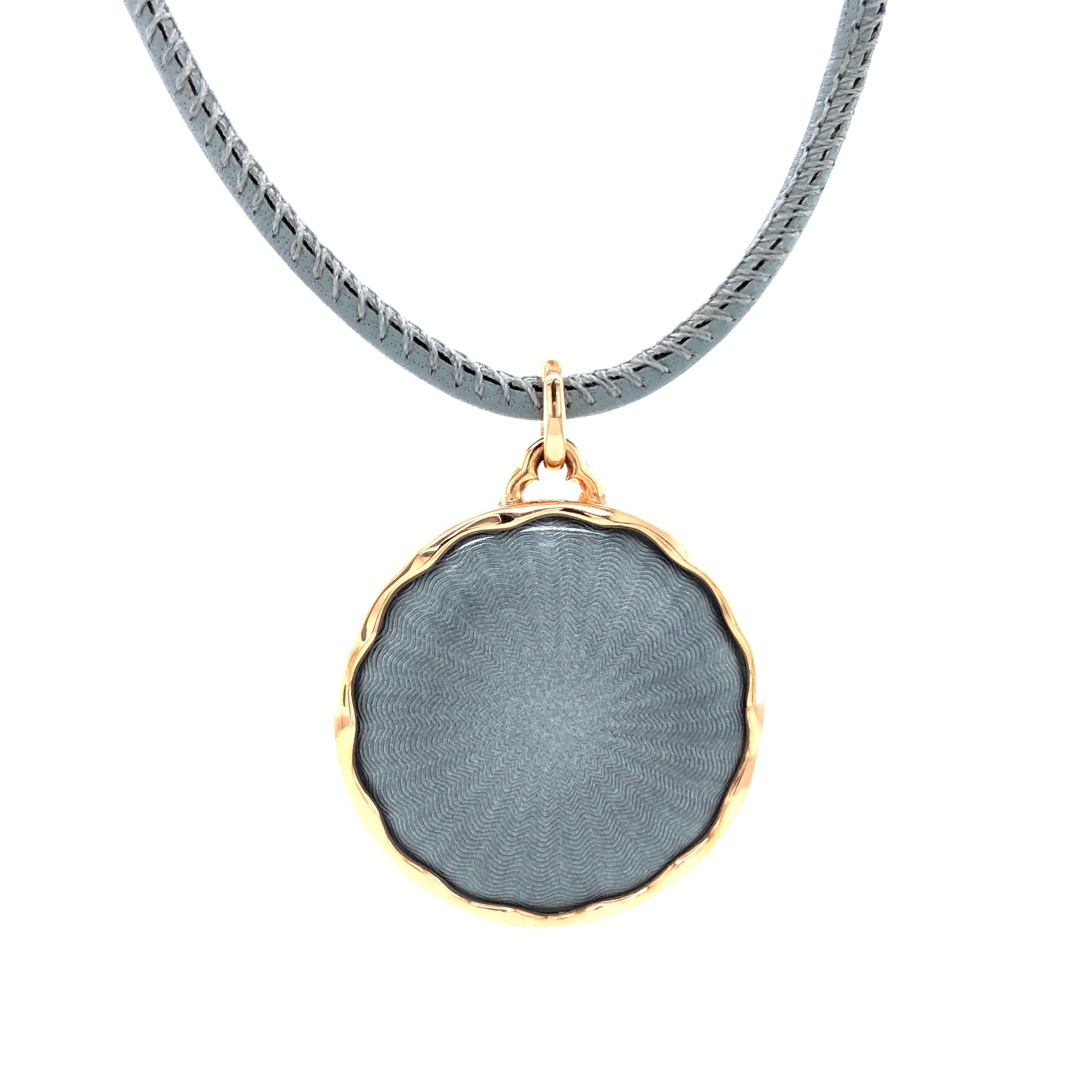 Victor Mayer round pendant collier 18k white gold/925-sterling silver, Macaron Collection, translucent grey vitreous enamel, guilloche, grey leather strap, diameter app. 27.2 mm

About the creator Victor Mayer
Victor Mayer is internationally