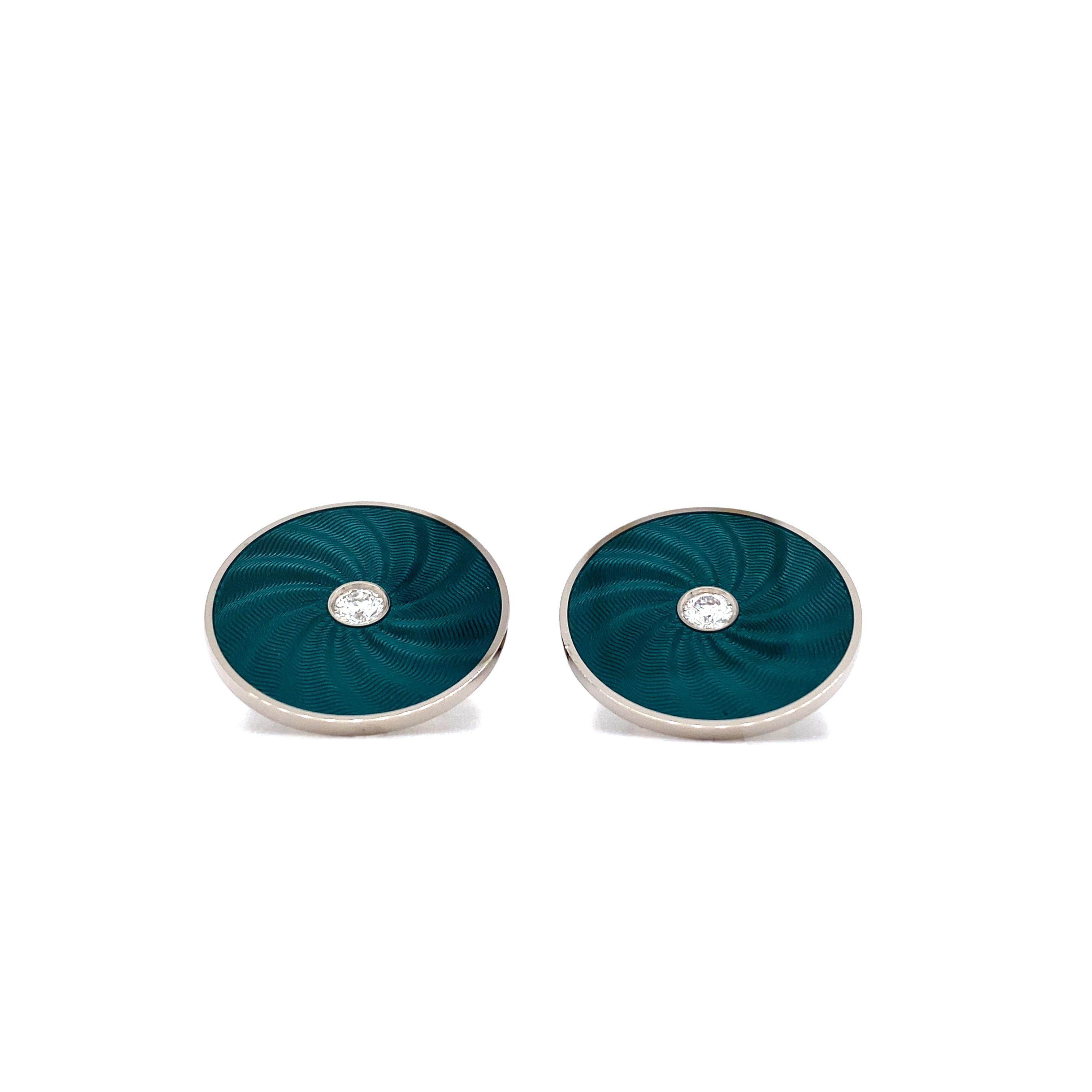 Victor Mayer Round Cufflinks 18k White Gold with Diamonds & Emerald Green Guilloche Enamel

Cuff links, 18k white gold, guilloche, vitreous enamel, 2 diamonds total 0,26 ct, G VS
Reference: V1057/SG/00/00/101
Material: 18k white gold
Vitreous