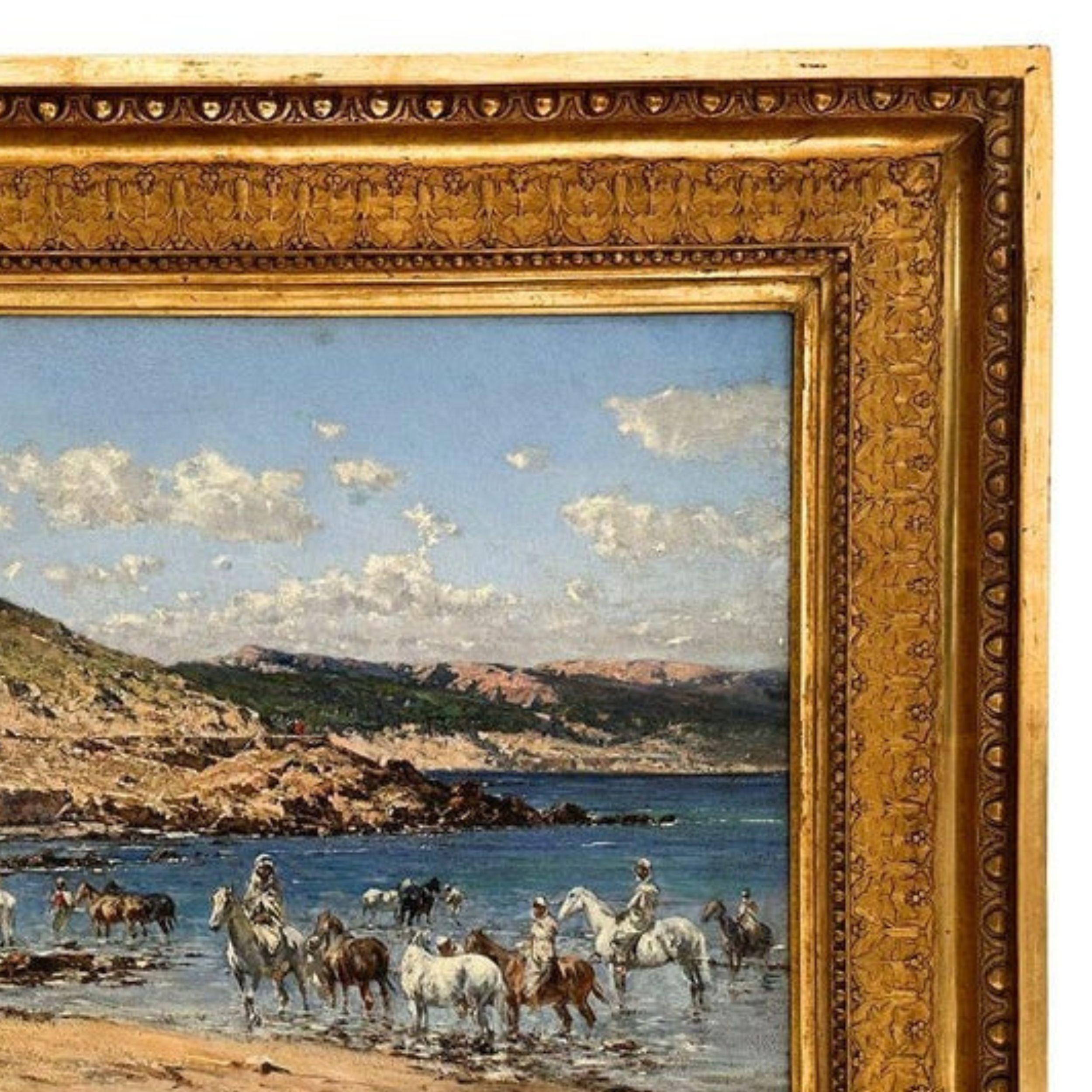 With an expert command of light and movement, Victor Huguet’s At the Shore transports the viewer to a coastal expanse where a group of Arab horsemen and figures gather against a stunning backdrop of rolling hills and shimmering waters. The artist’s