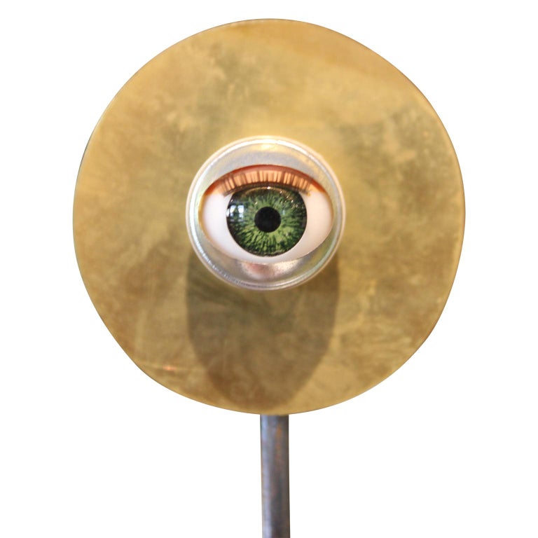 Abstract circular eyeball sculpture planted in a terracotta pot. The work is signed and dated by the artist on the back of the sculpture. Victor Rojas is an emerging artist in the Texas region and Houston, Texas.
