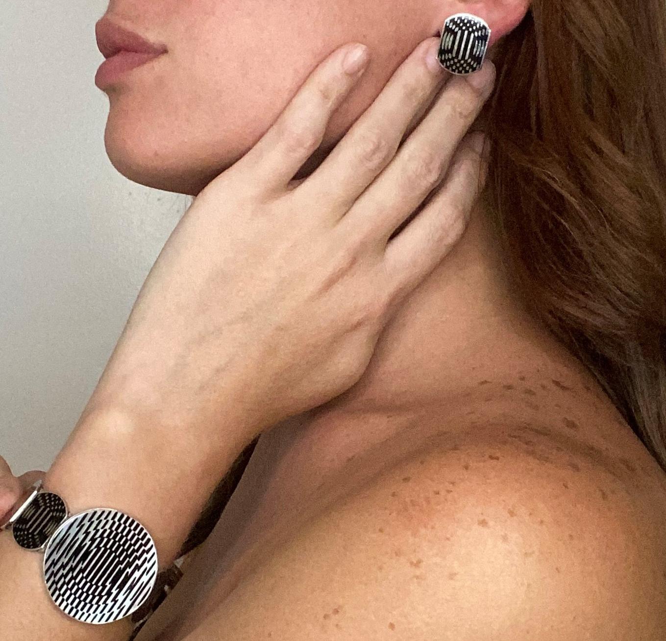 An Op-art Geometric earrings designed by Victor Vasarely (1906-1997).

Beautiful wearable pieces of art, created in London England by the Op-art artist Victor Vasarely. This very rare sculptural pair of earrings has been carefully crafted in solid