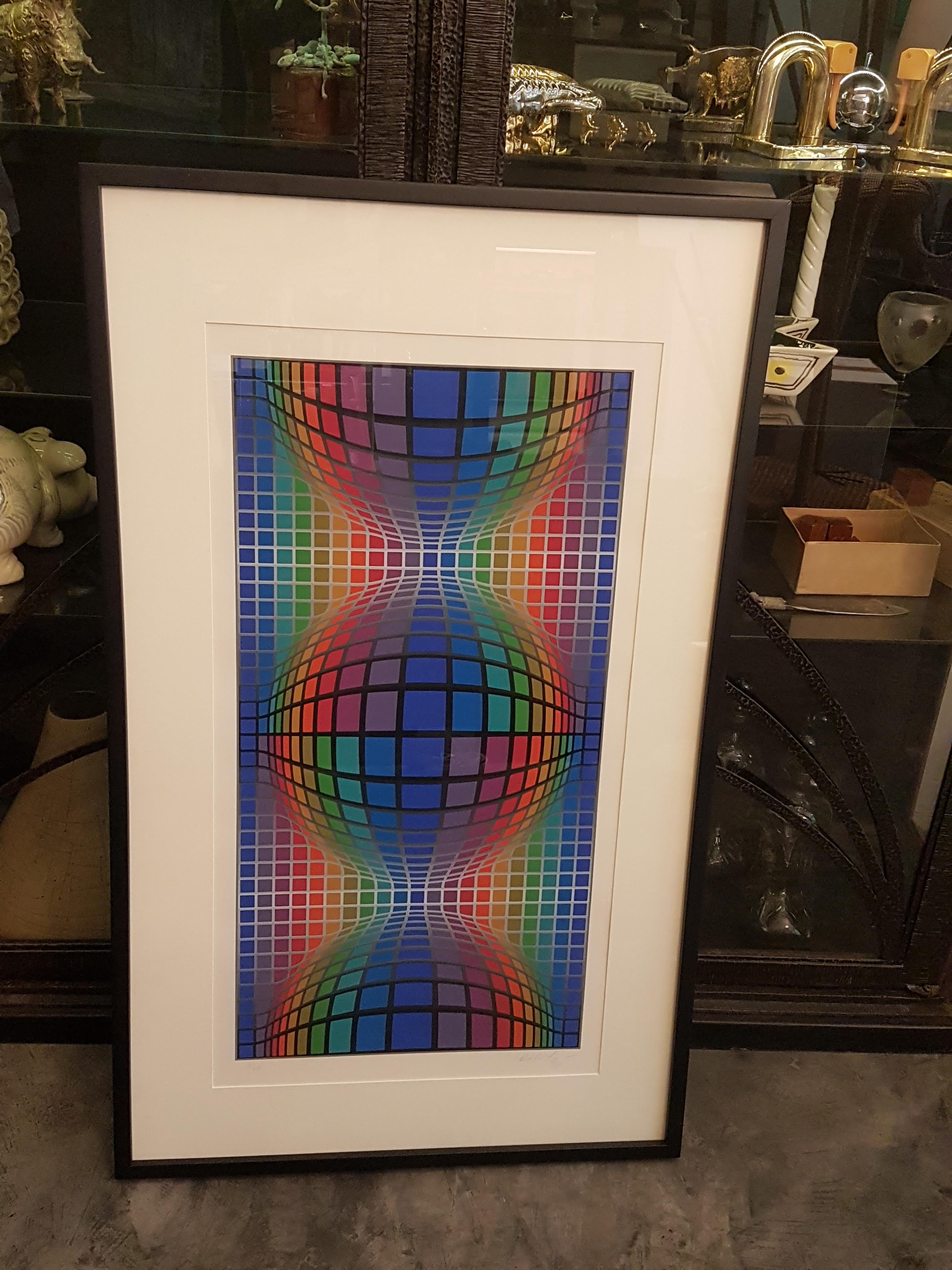 A beautiful silkscreen print by Hungary-born French artist Victor Vasarely. Series 3/250. Signed by the artist.

Print's dimensions: 82 x 41 cm. (32.25 x 16.125 inches).