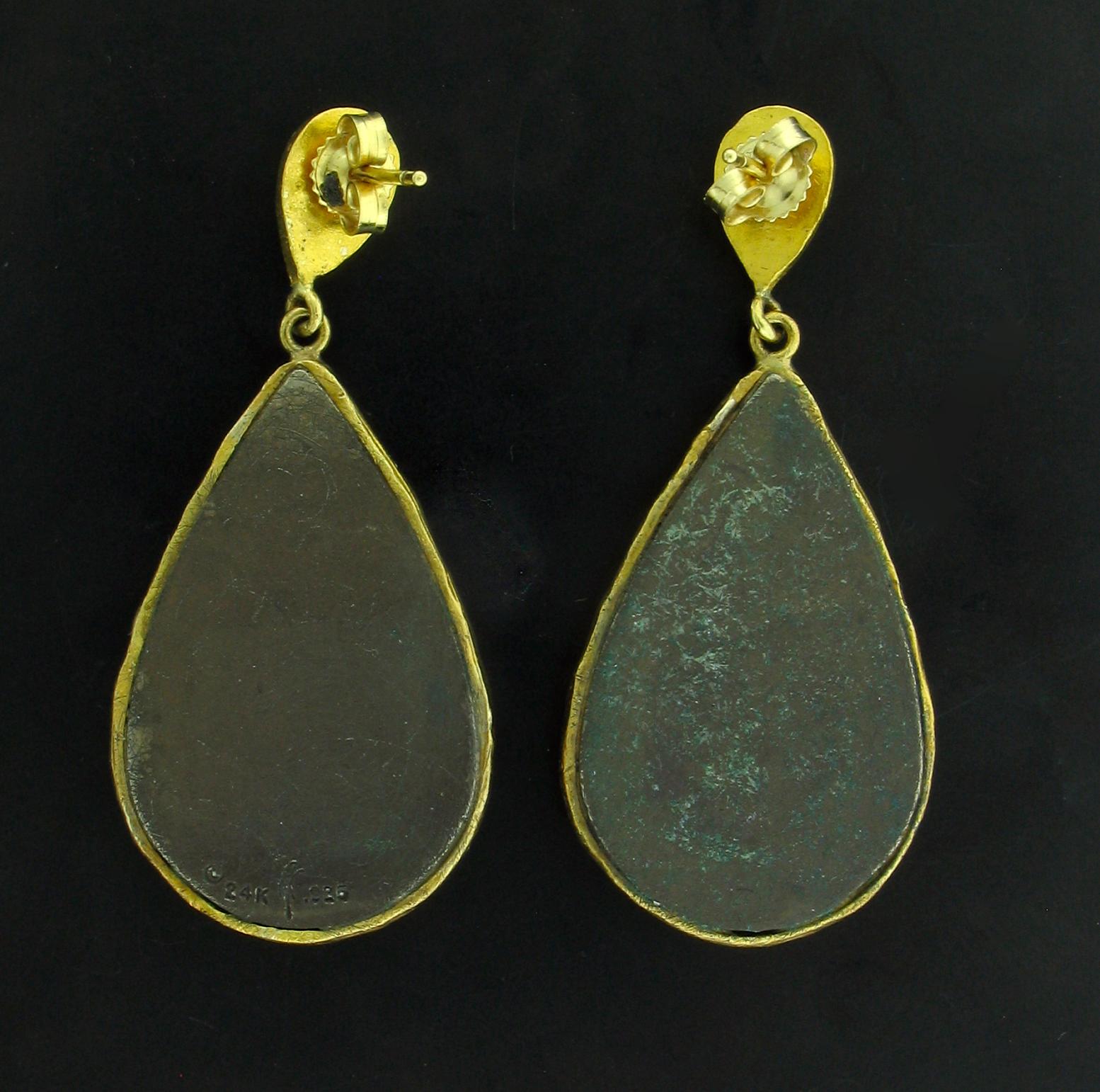 These Earrings were designed and made by well known designer Victor Velyan.   They contain 8 cabochon Chrome Diopsides weighing 1.25 carats.  They are made of a base of pure Silver with all accent work created in 24k yellow Gold.  The 'green' is a