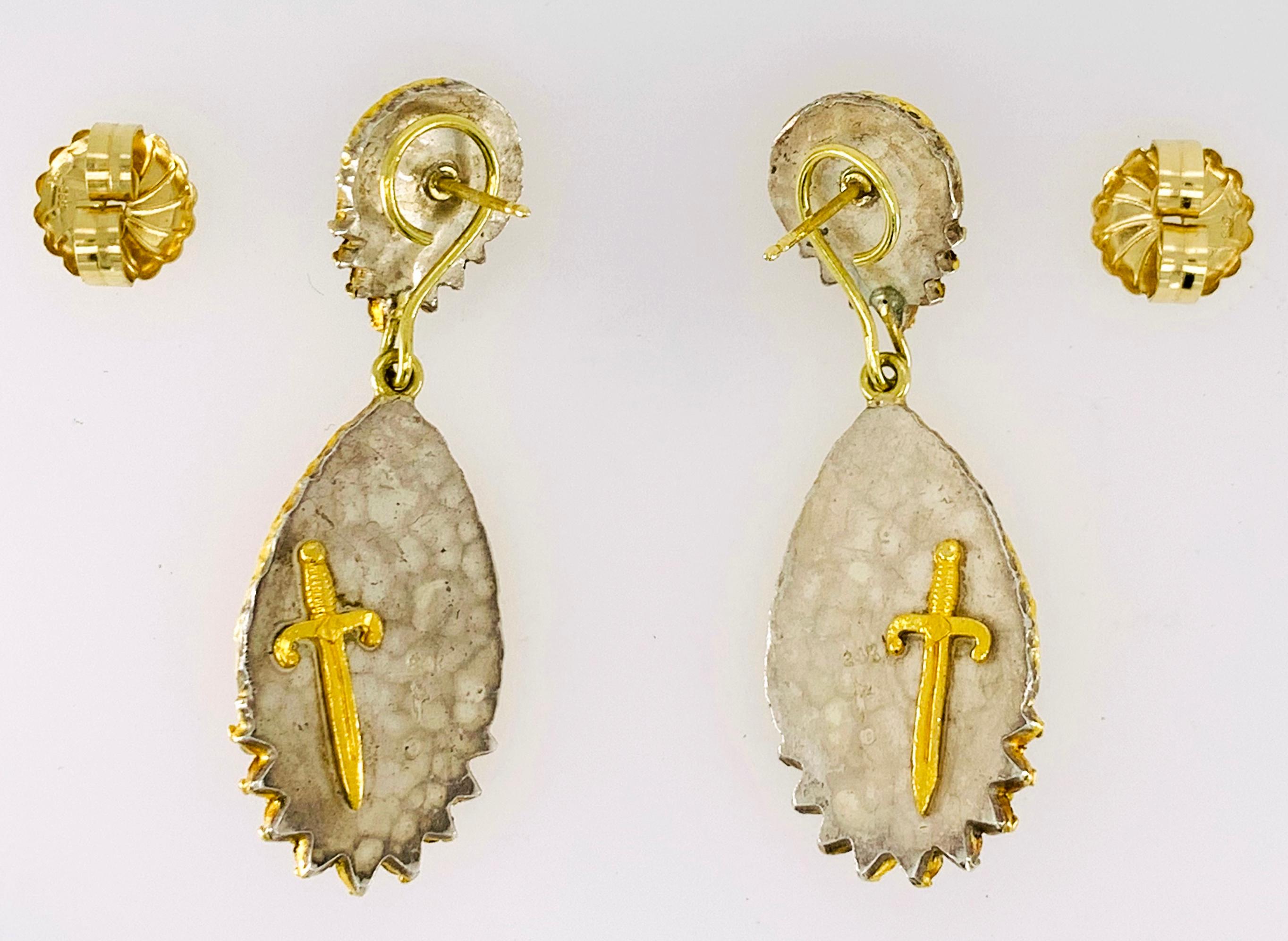 These earrings were designed and made by well known designer Victor Velyan.  They feature 2 pear shaped, faceted Fire Opals weighing 7.55 carats, 2 pear shaped, faceted Spessartites (a special Garnet) weighing 4.66 carats and round brilliant cut