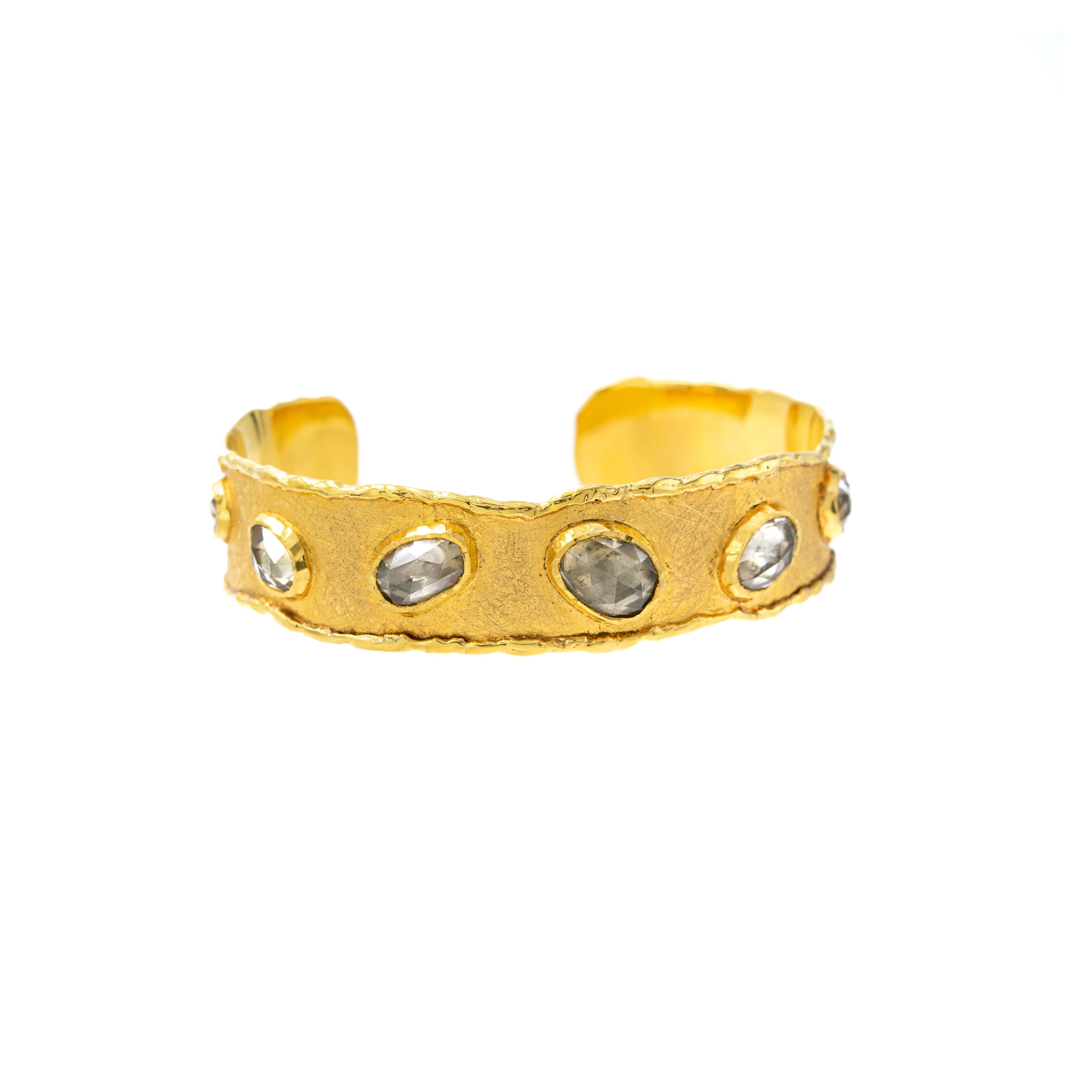 Inspired by the energy pulsating throughout nature, Velyan unites pure metals and gemstones into stunning styles that display the grandeur of fine jewelry.

This cuff bracelet features zircon stones set in 18k and 24k yellow gold.

Details:
Zircon