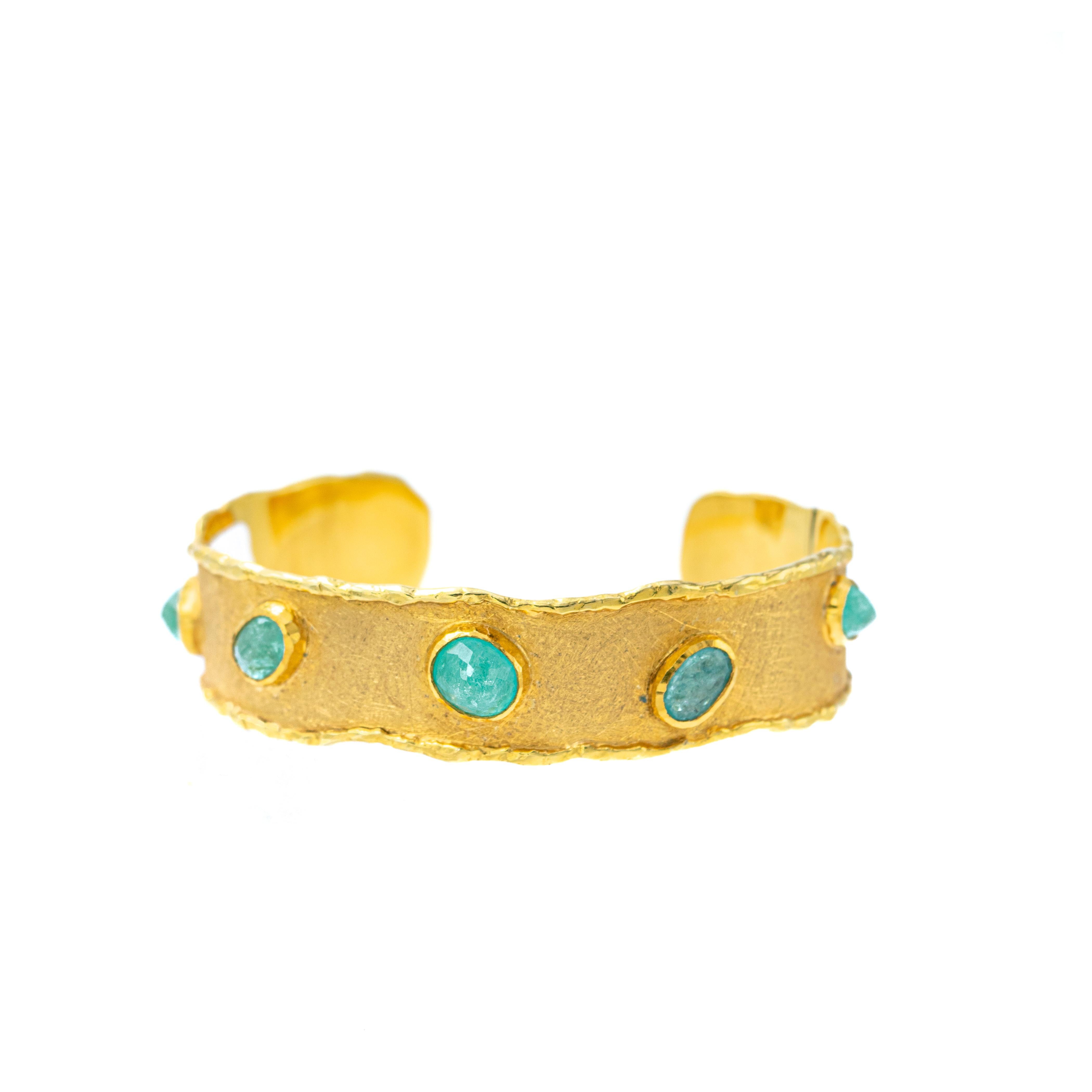 nspired by the energy pulsating throughout nature, Velyan unites pure metals and gemstones into stunning styles that display the grandeur of fine jewelry.

This cuff bracelet features Paribas set in 18k and 24k yellow gold.

Details
Paraiba