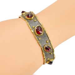 Bracciale a cuffia Victor Velyan in argento sterling e oro giallo 24k con granato spessartite