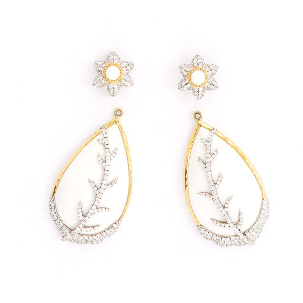 Inspired by the energy pulsating throughout nature, Velyan unites pure metals and gemstones into stunning styles that display the grandeur of fine jewelry.

These earrings feature opals with white pavé diamonds set in 24k yellow gold. The teardrop