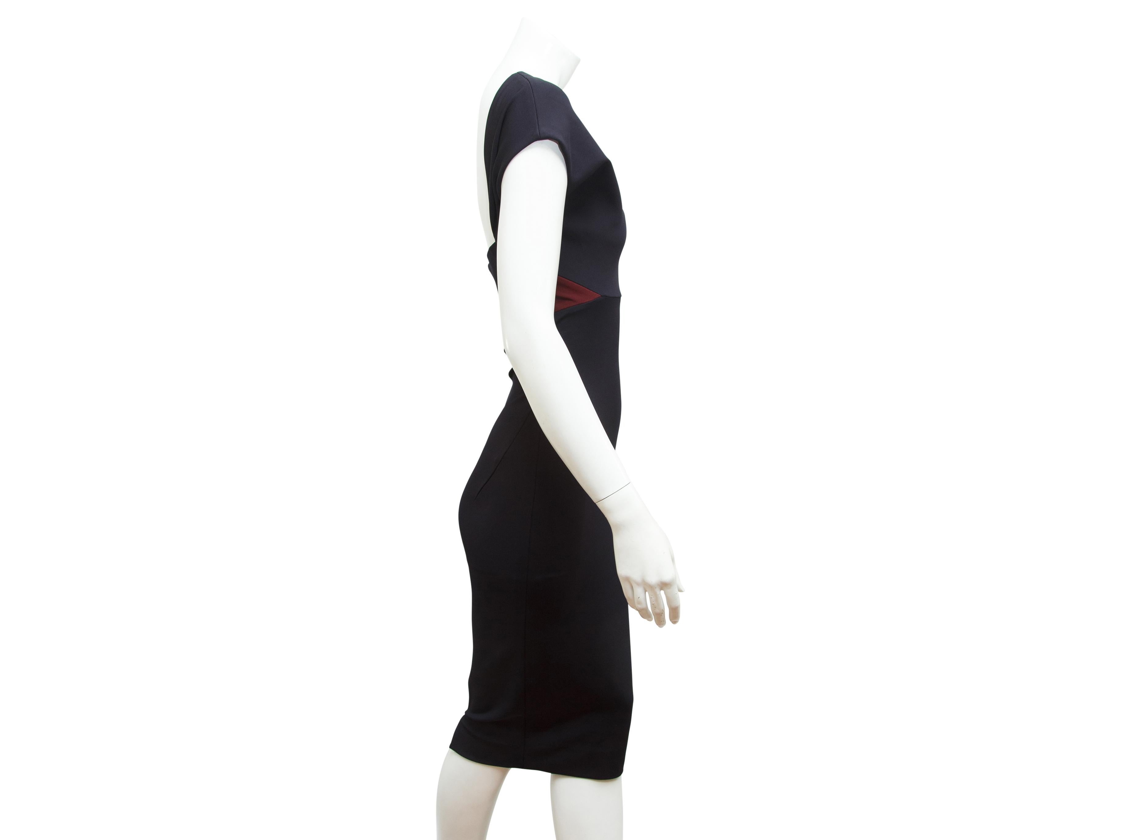 Product details:  Black and burgundy sheath dress by Victoria Beckham.  Boatneck.  Short dolman sleeves.  Open back.  Exposed back zip closure.  Silvertone hardware.  34